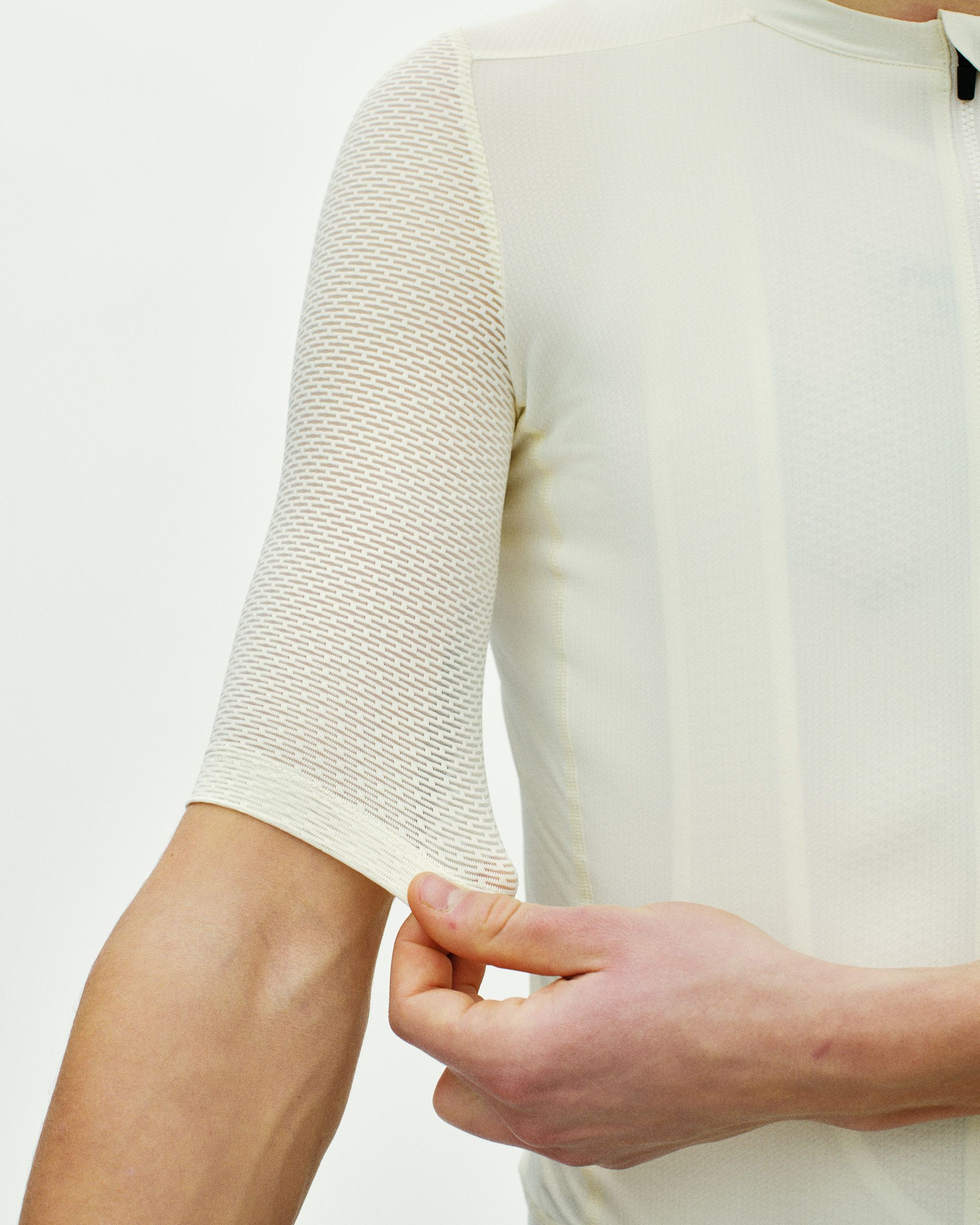 Off White Essential Light cycling jersey on model showing textured sleeve detail