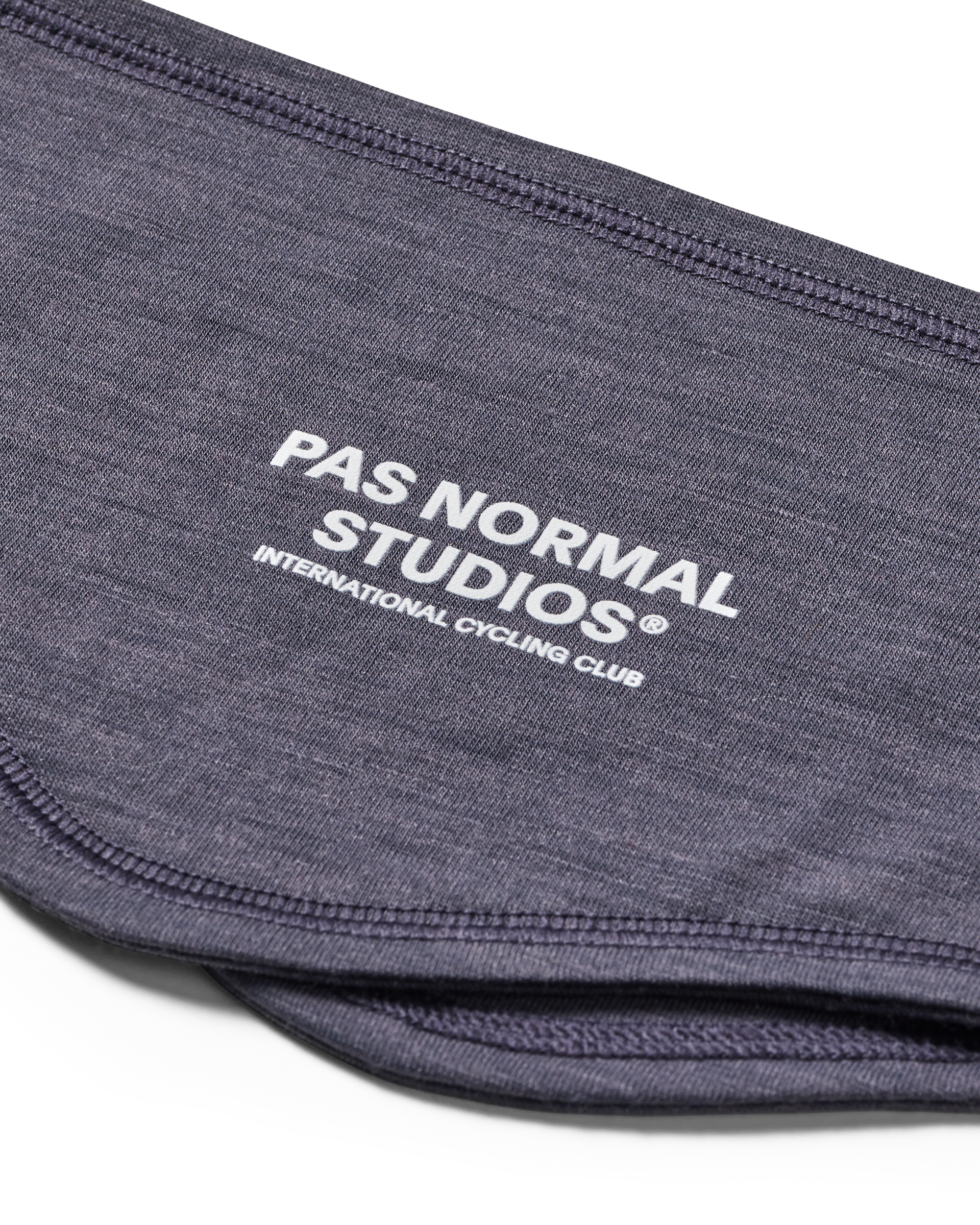 Grey Logo Merino headband, detail view showing white brand text and contrast stitching