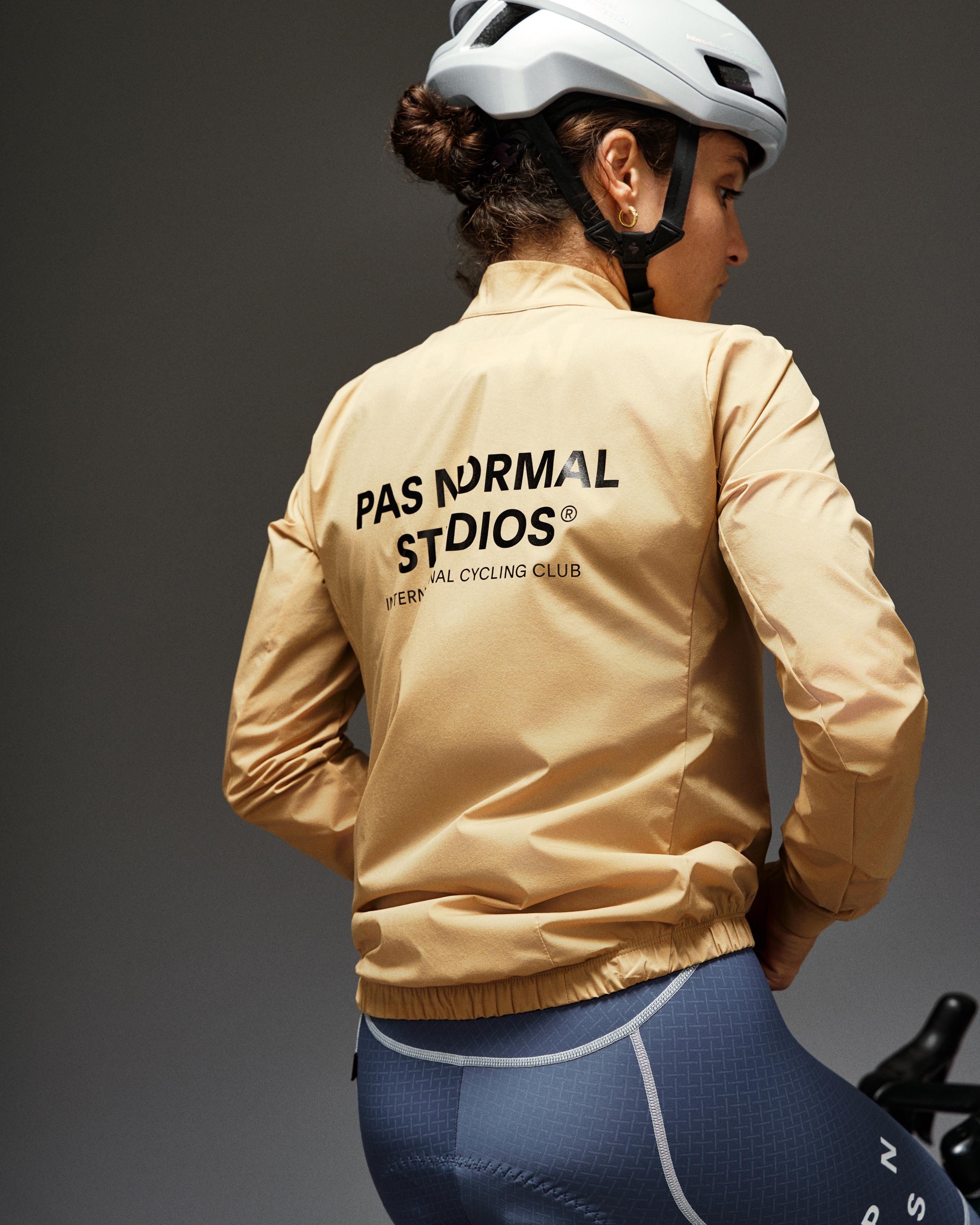 Camel Mechanism Stow Away jacket on model, rear view with black logo print