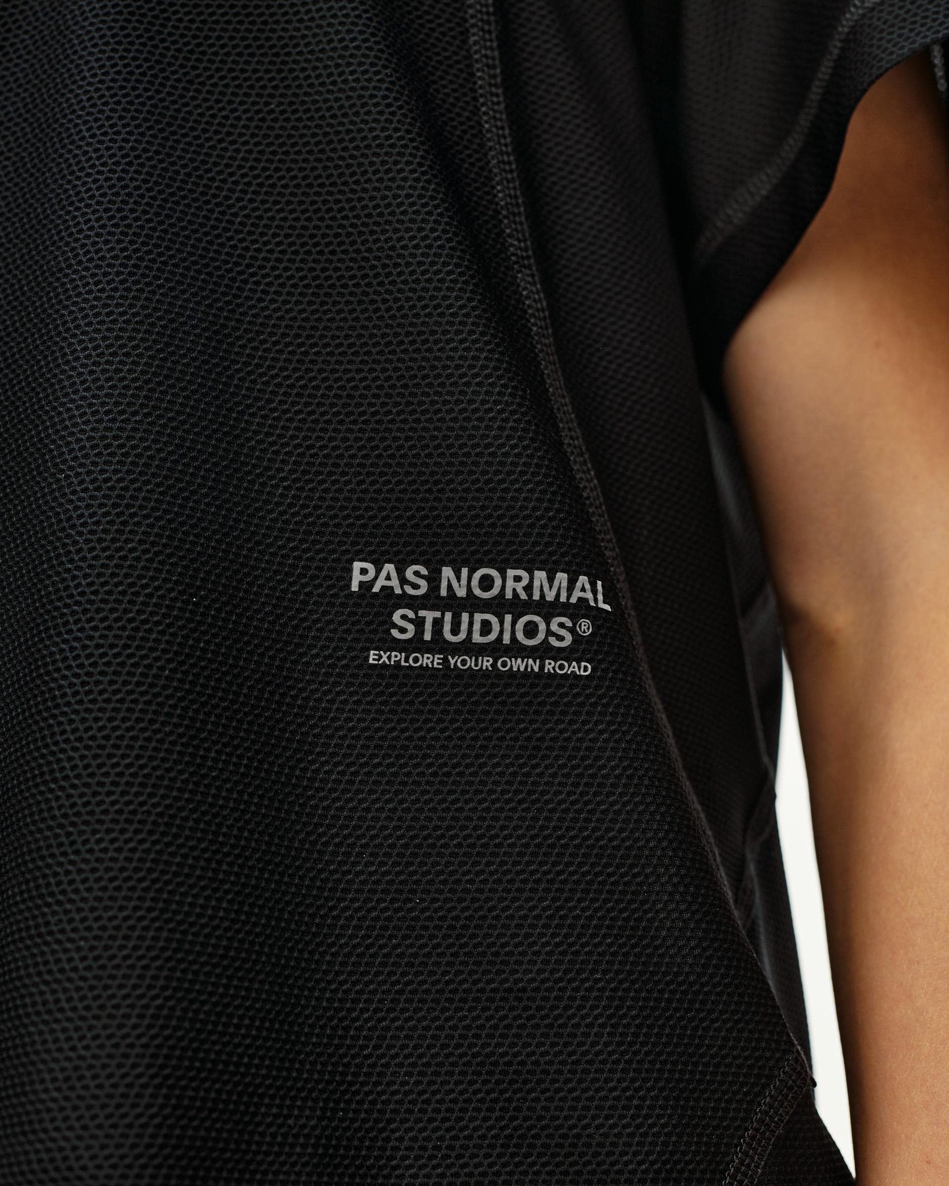 Green Sage Balance T-shirt, detail view on model with textured mesh fabric and brand logo print