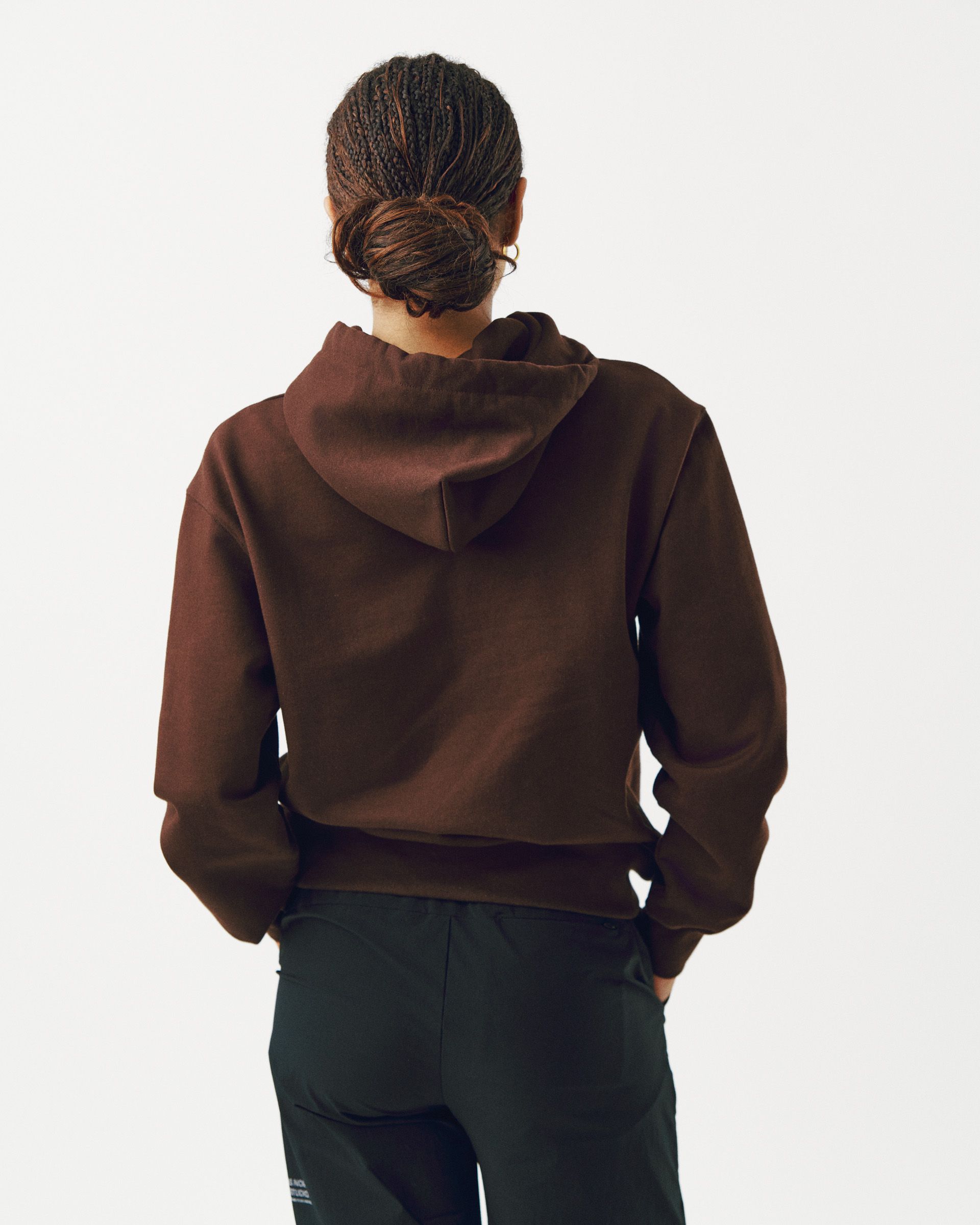 Light Brown Off-Race hoodie on model, rear view showing hood and relaxed fit
