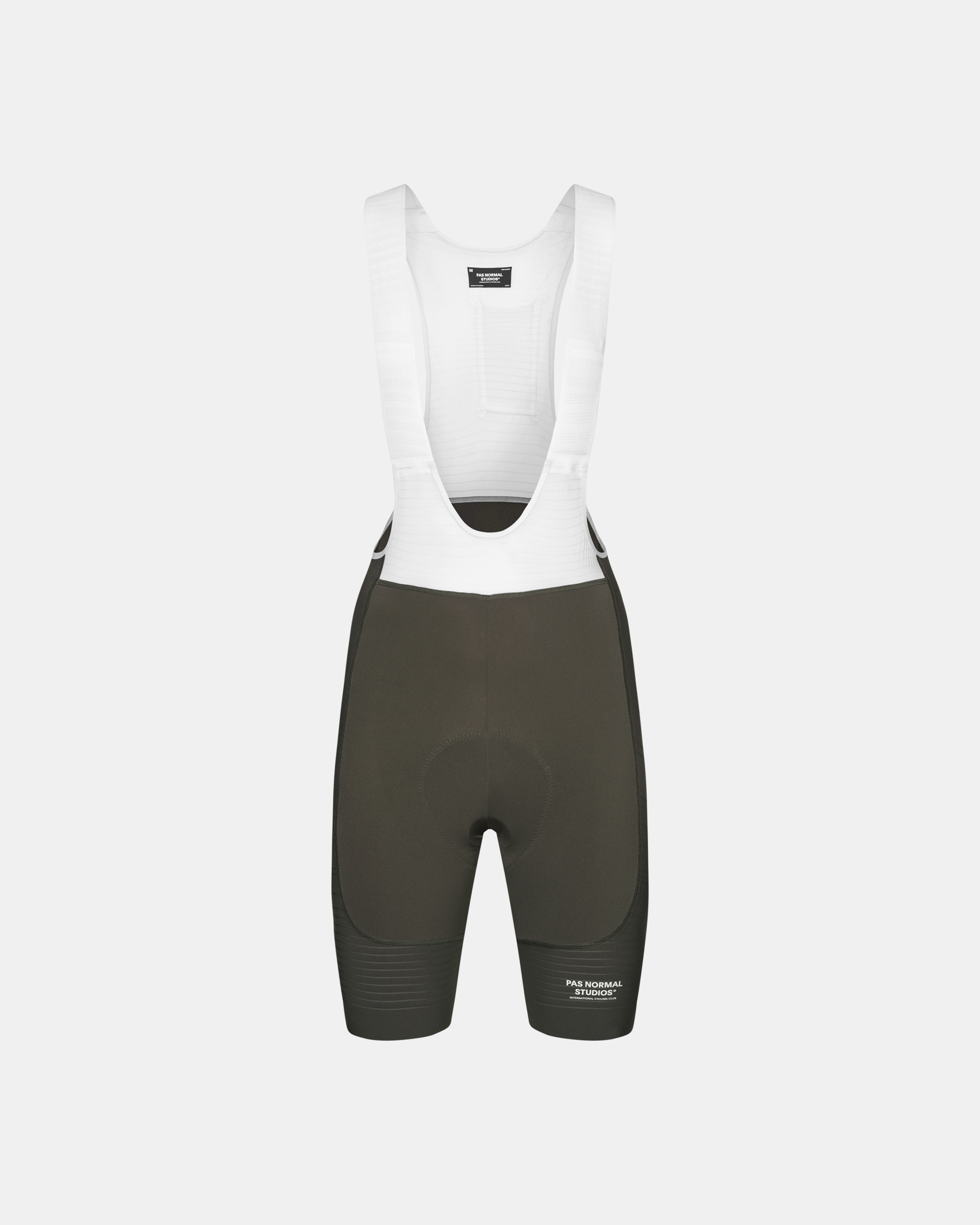 Dark Olive Mechanism Pro cycling bibs, front flat lay with white mesh bib straps