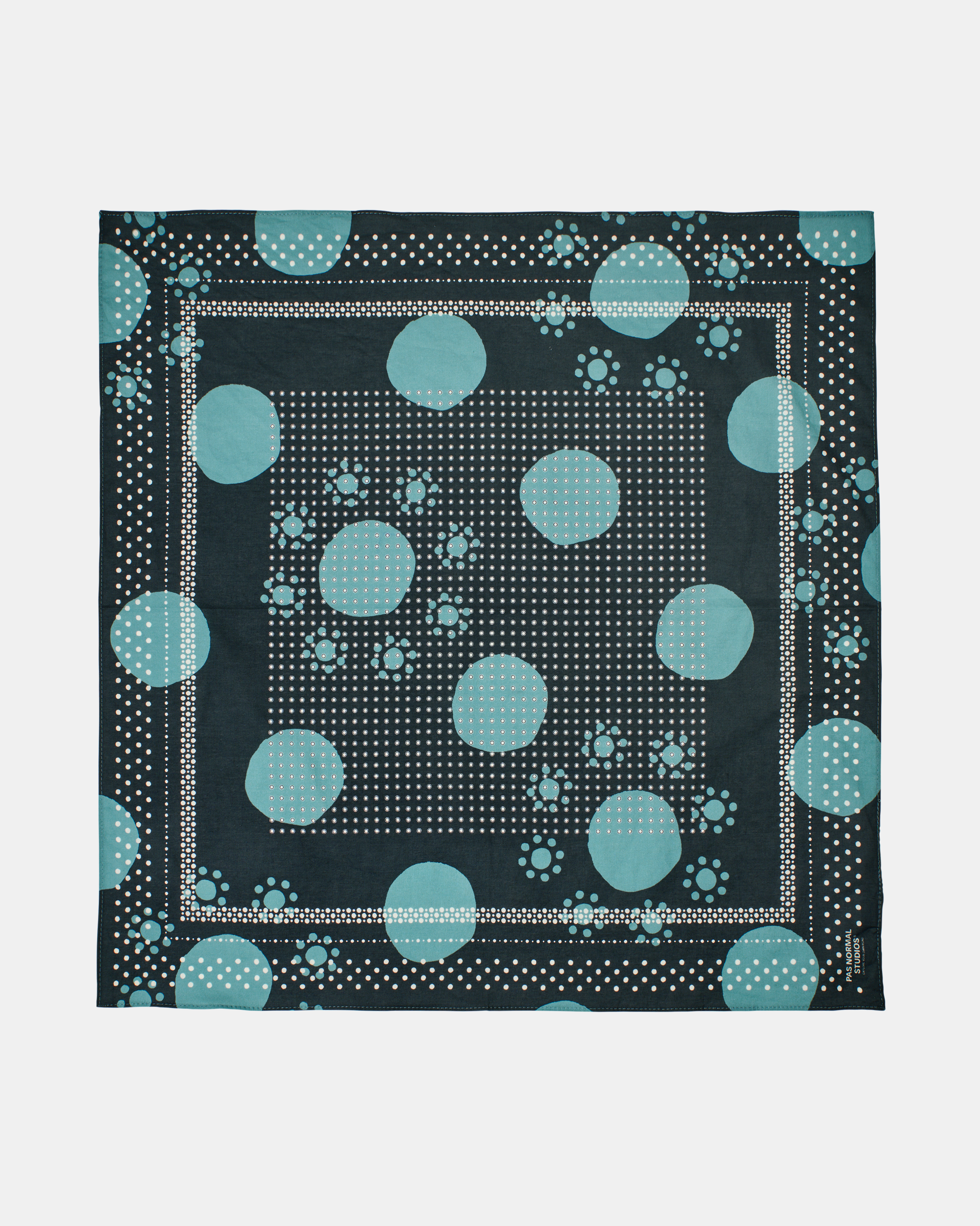 Navy Off-Race bandana, flat lay with teal polka dot pattern and white dotted border