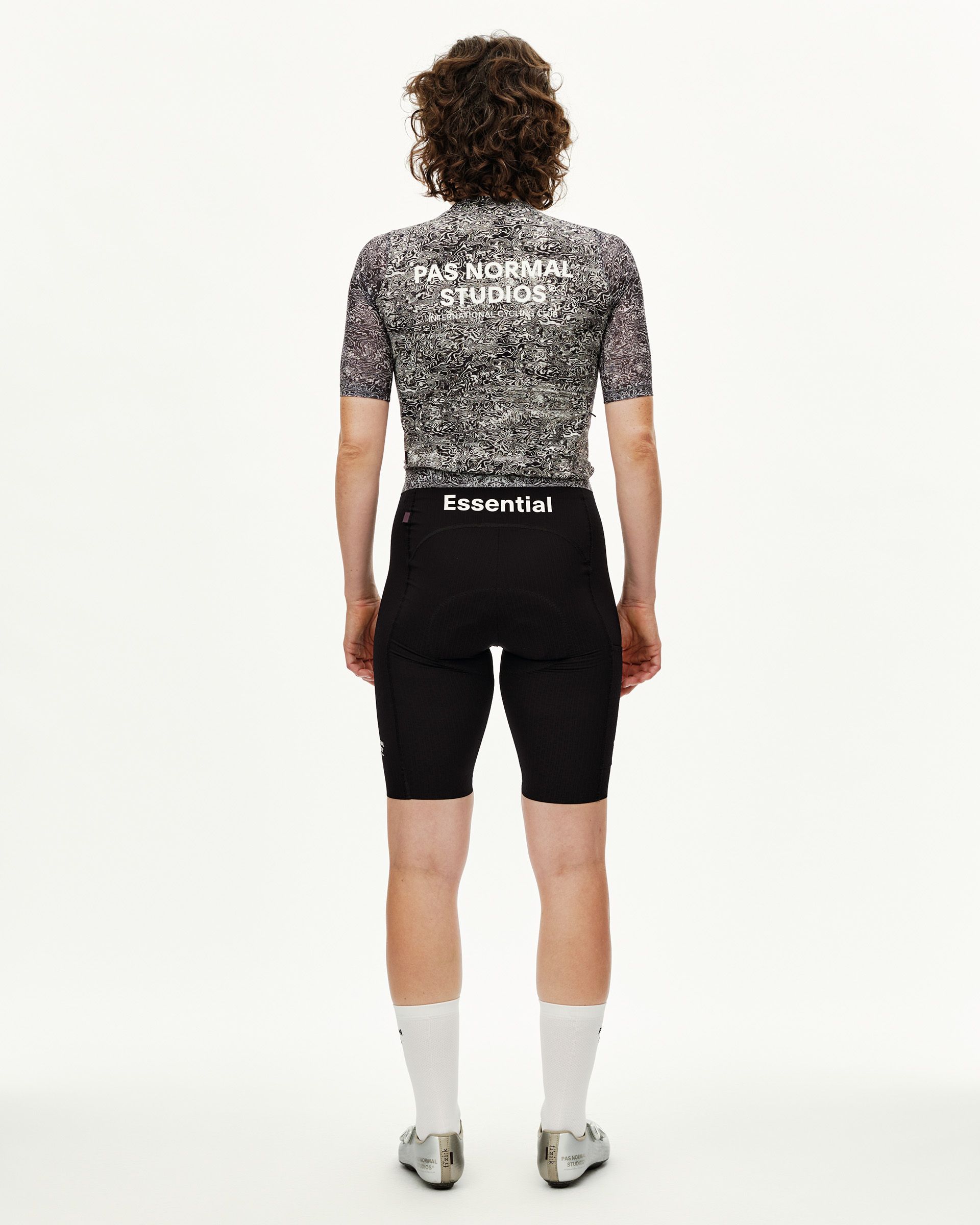 Off White Essential cycling jersey on model, rear view with black and white allover graphic print