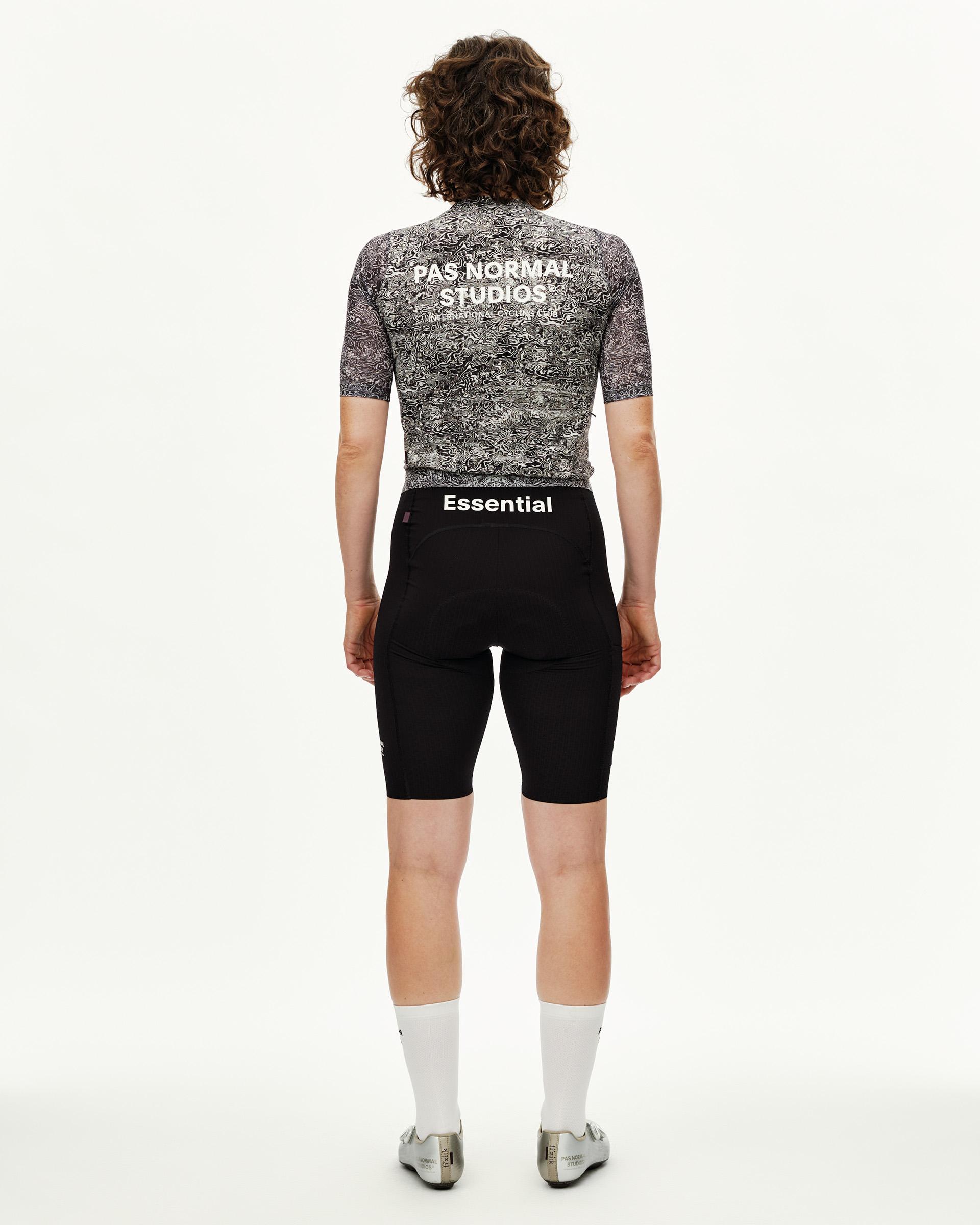 Off White Essential cycling jersey on model, rear view with black and white allover graphic print