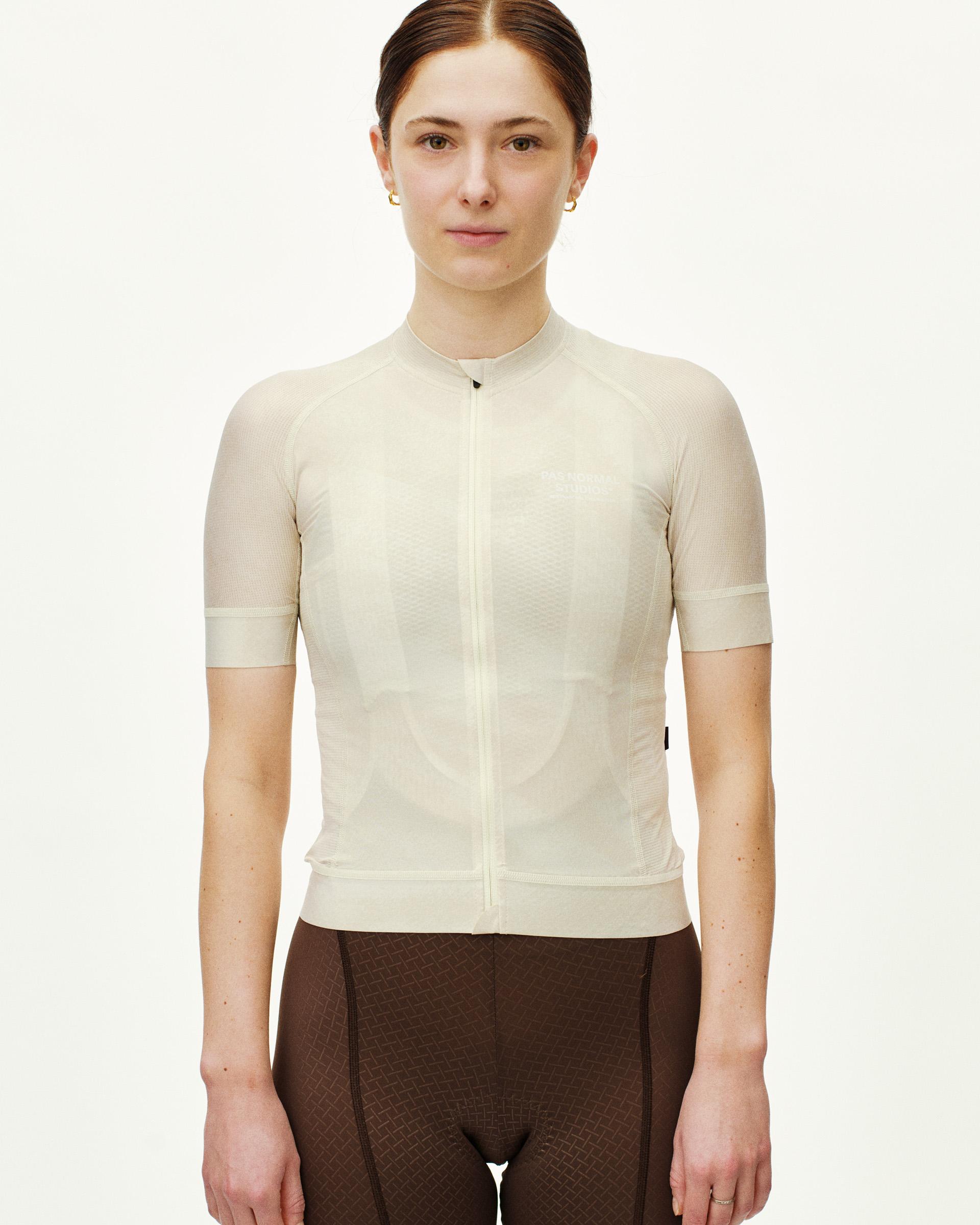 Off White Mechanism cycling jersey on model, front view with full zip and ribbed collar