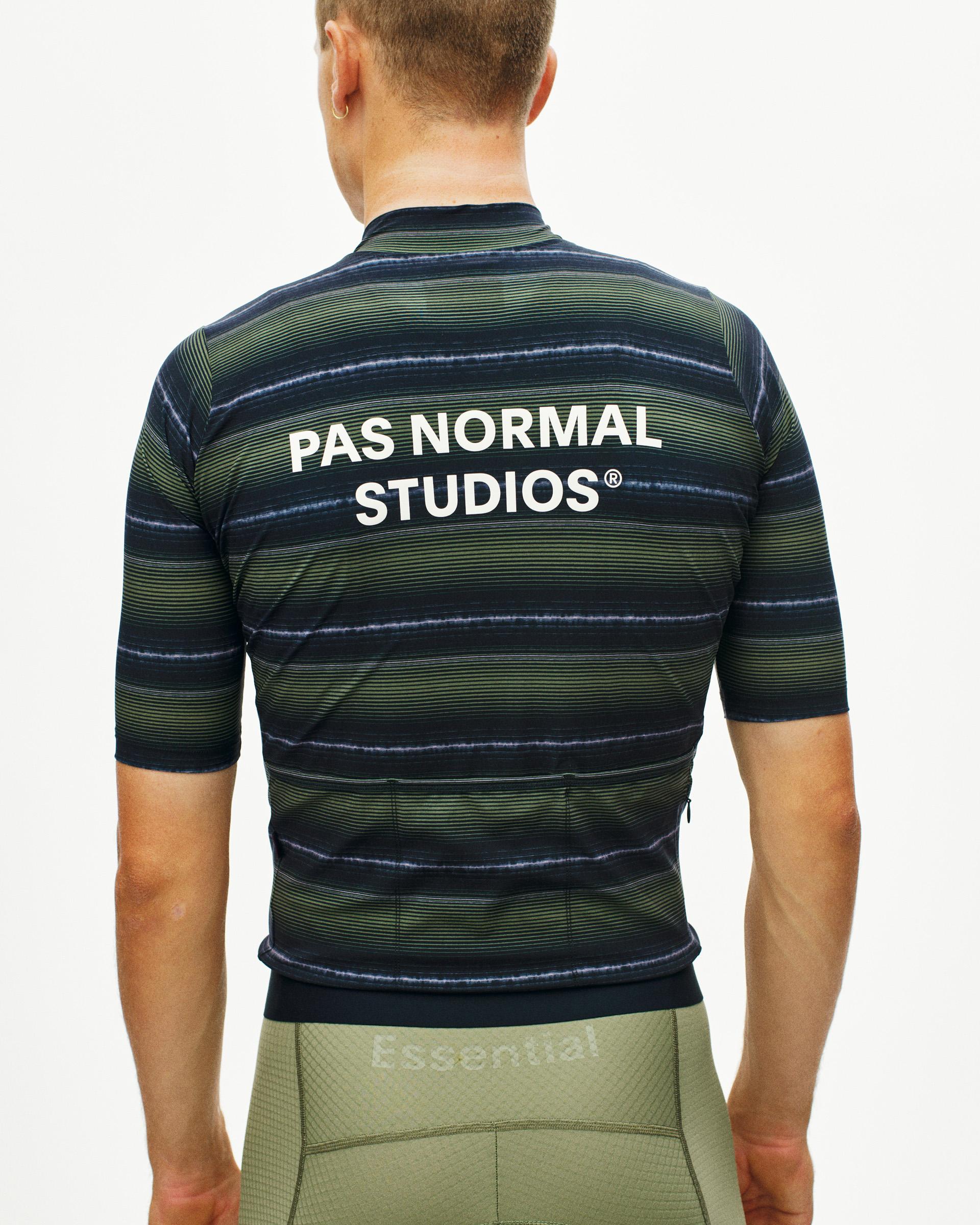 Light Olive Essential cycling jersey, rear view on model with horizontal stripe pattern