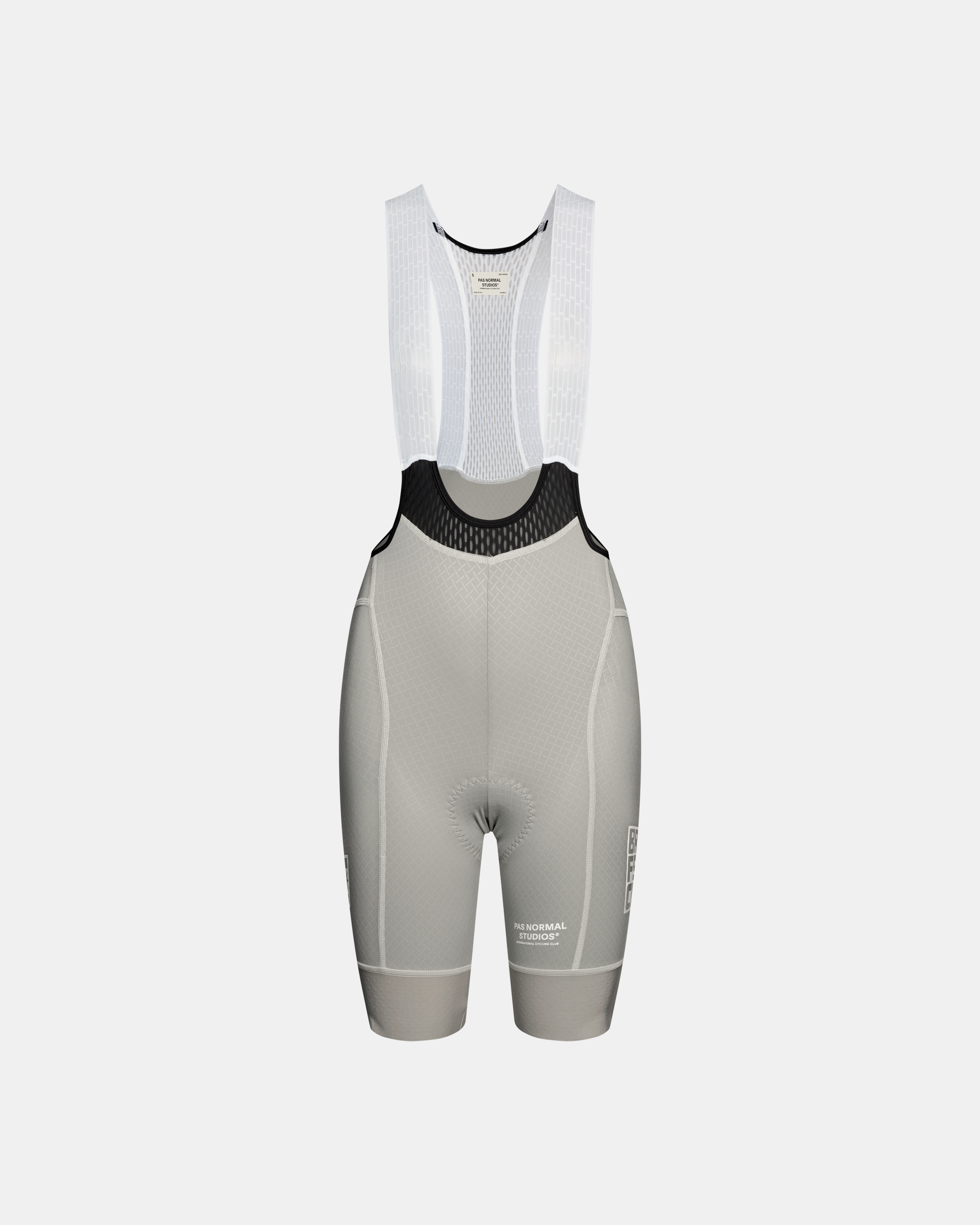 Light Grey Mechanism Breakfast Club women's cycling bibs, front flat lay with white mesh straps and black bib panel