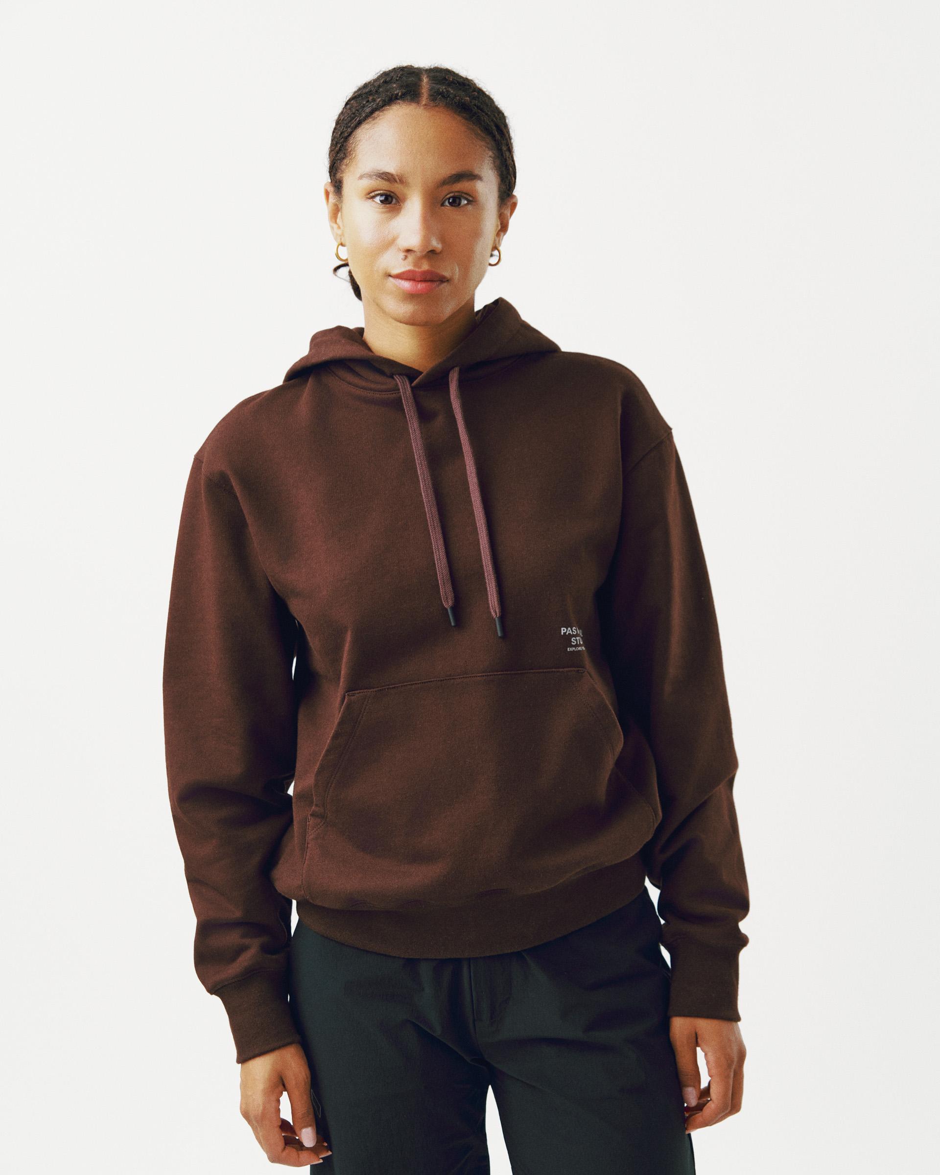 Light Brown Off-Race hoodie on model with kangaroo pocket and small chest logo