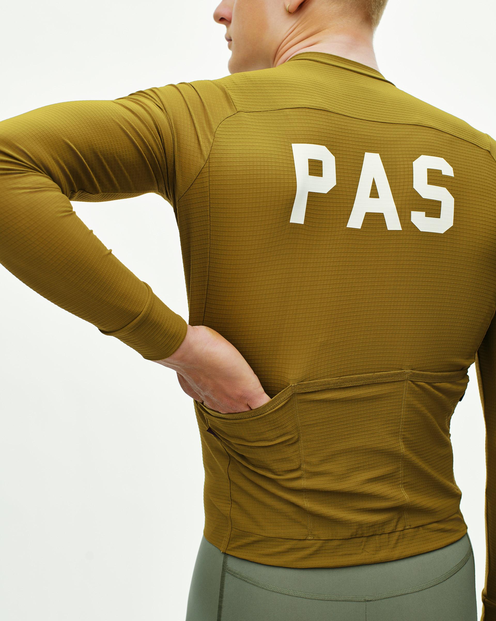 Khaki Green PAS Mechanism Pro long sleeve cycling jersey, rear view on model with white back print
