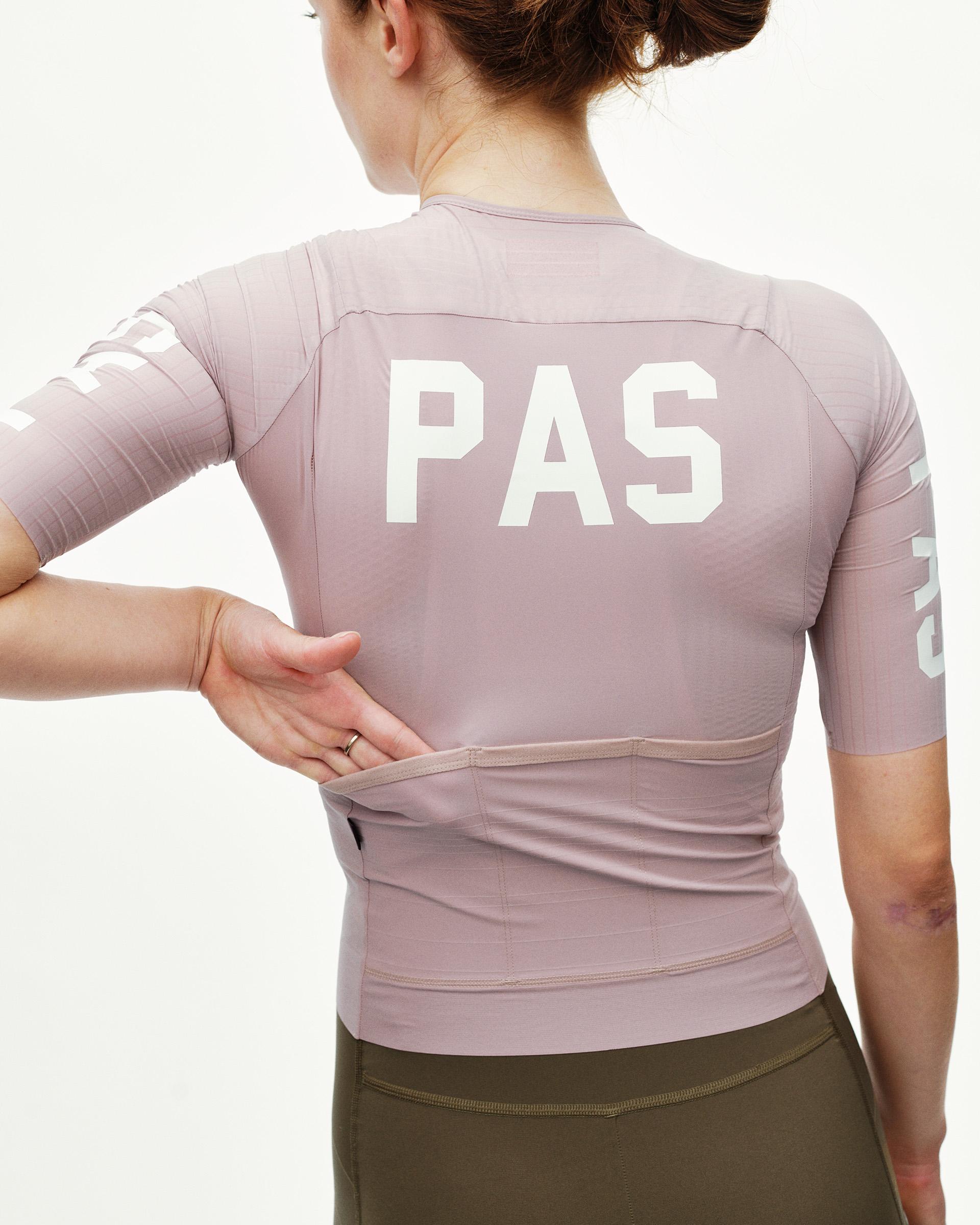 Taupe Rose PAS Mechanism Pro women's cycling jersey, rear view on model with large white PAS back print
