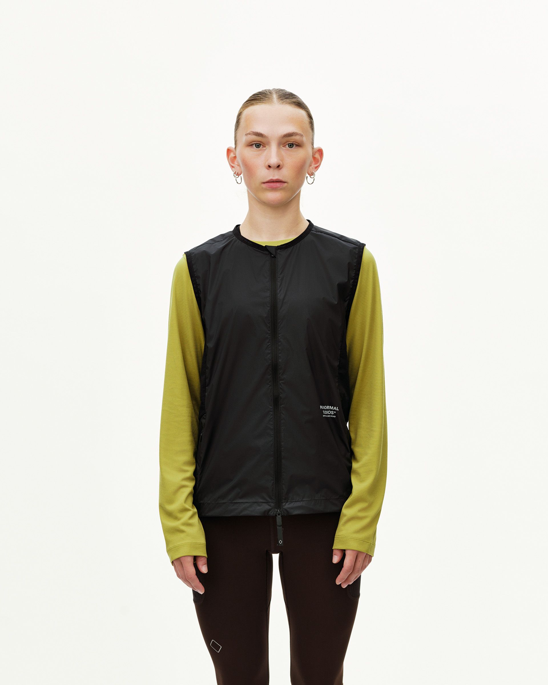 Black Balance Windproof vest on model, front view with centre zip and small chest logo print