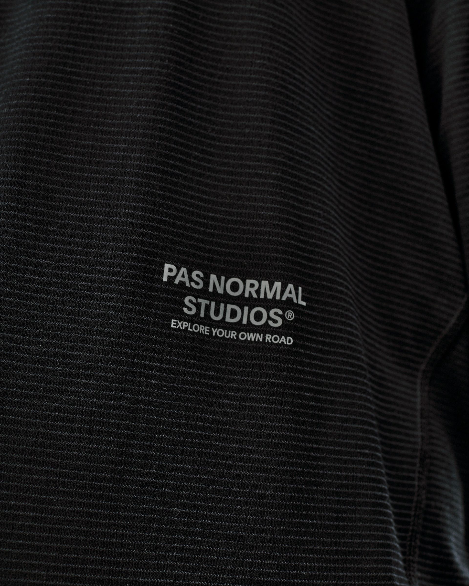 Black Balance long sleeve T-shirt, chest detail view with ribbed texture and white logo print