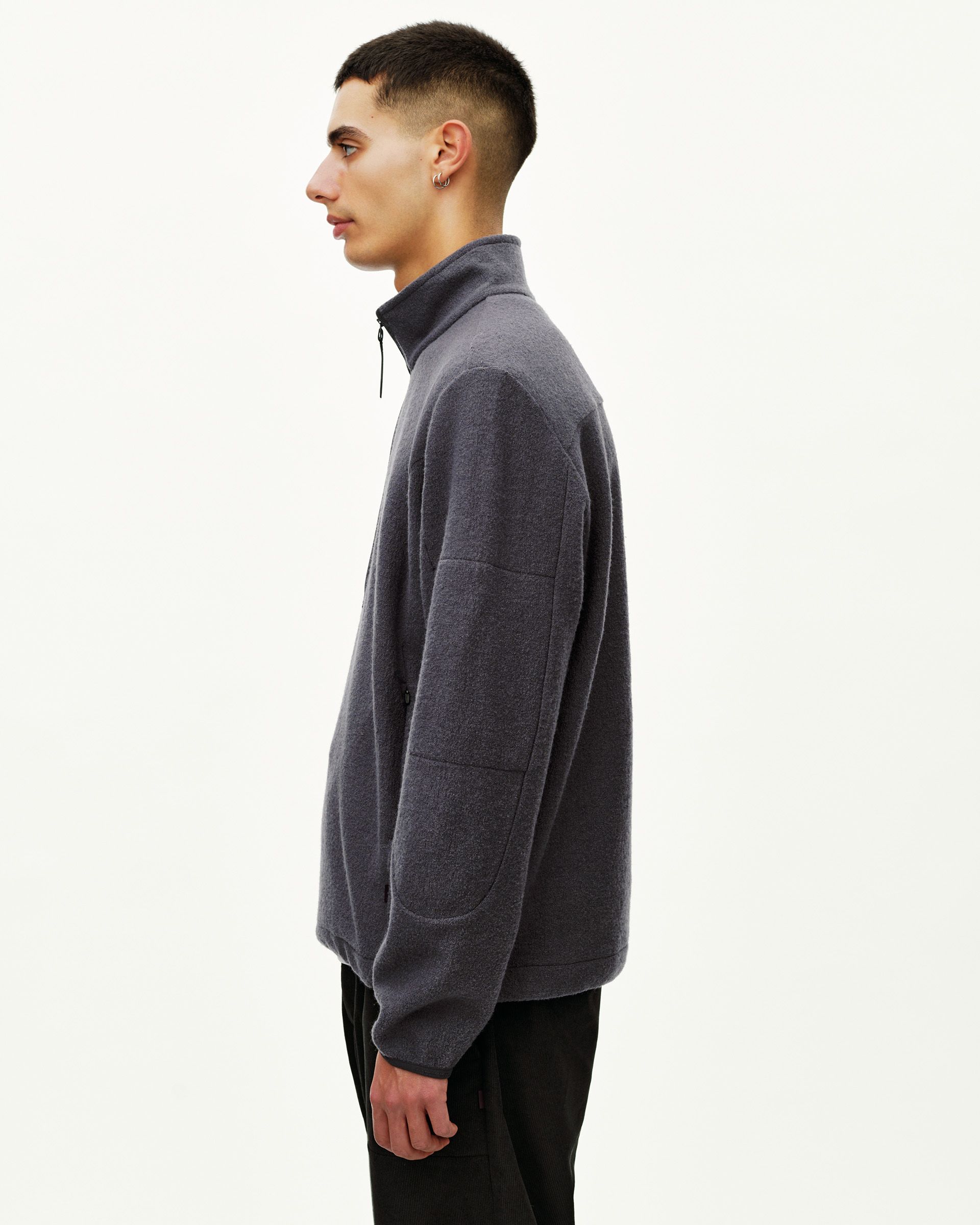 Steel grey Off-Race Boiled Wool Half-Zip outerwear on model, side view with quarter-zip collar