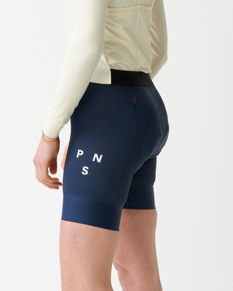 Navy Mechanism bibs on model, side view with white leg logo and textured panel