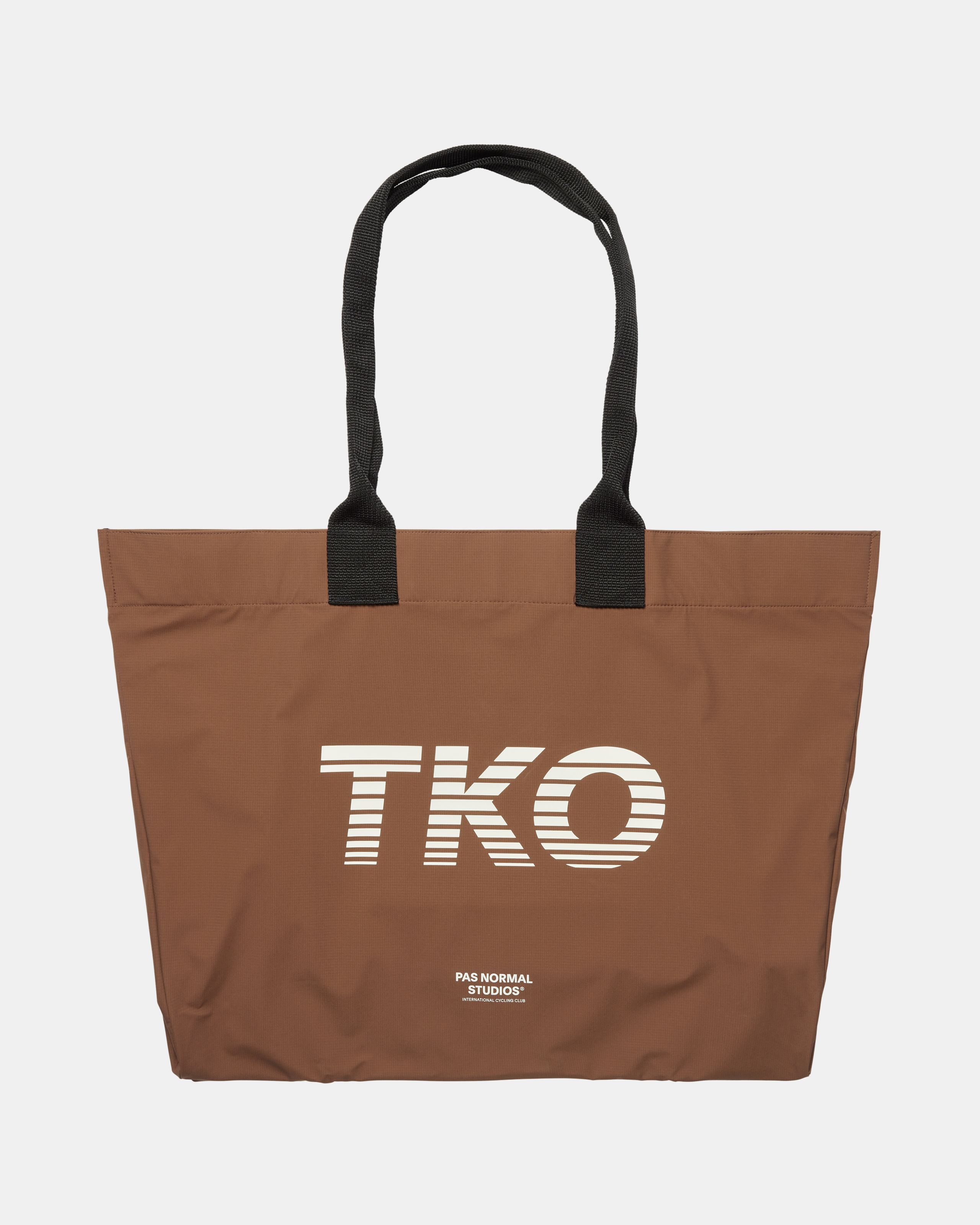 Hazel brown T.K.O. Shield tote bag, front flat lay with striped cream logo print and black handles