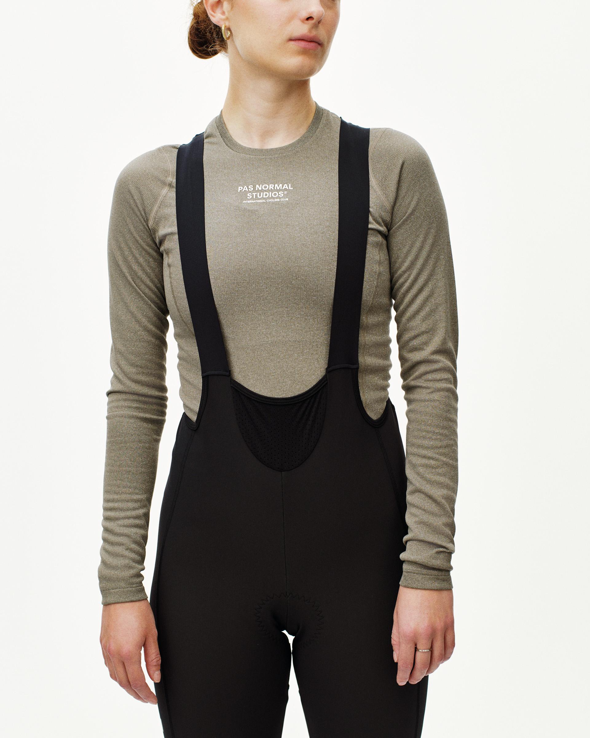 Black Mechanism Deep Winter Long bibs on model, front view with adjustable shoulder straps