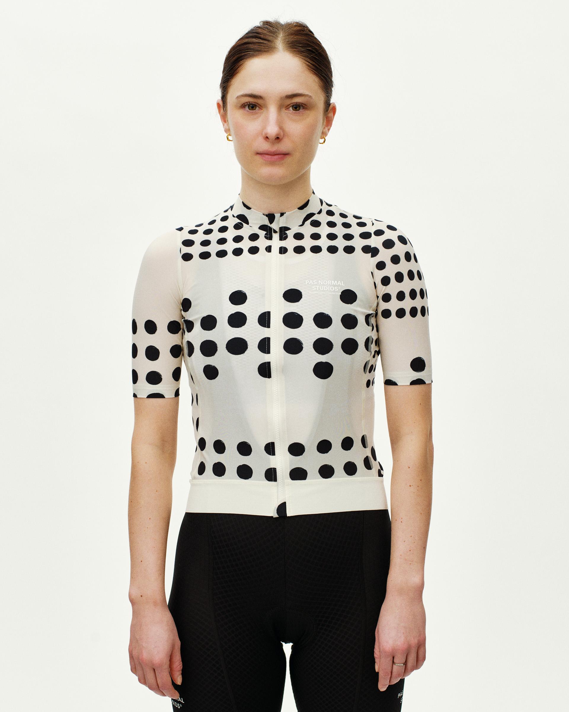 Off White Essential women's cycling jersey, front view on model with black polka dot print