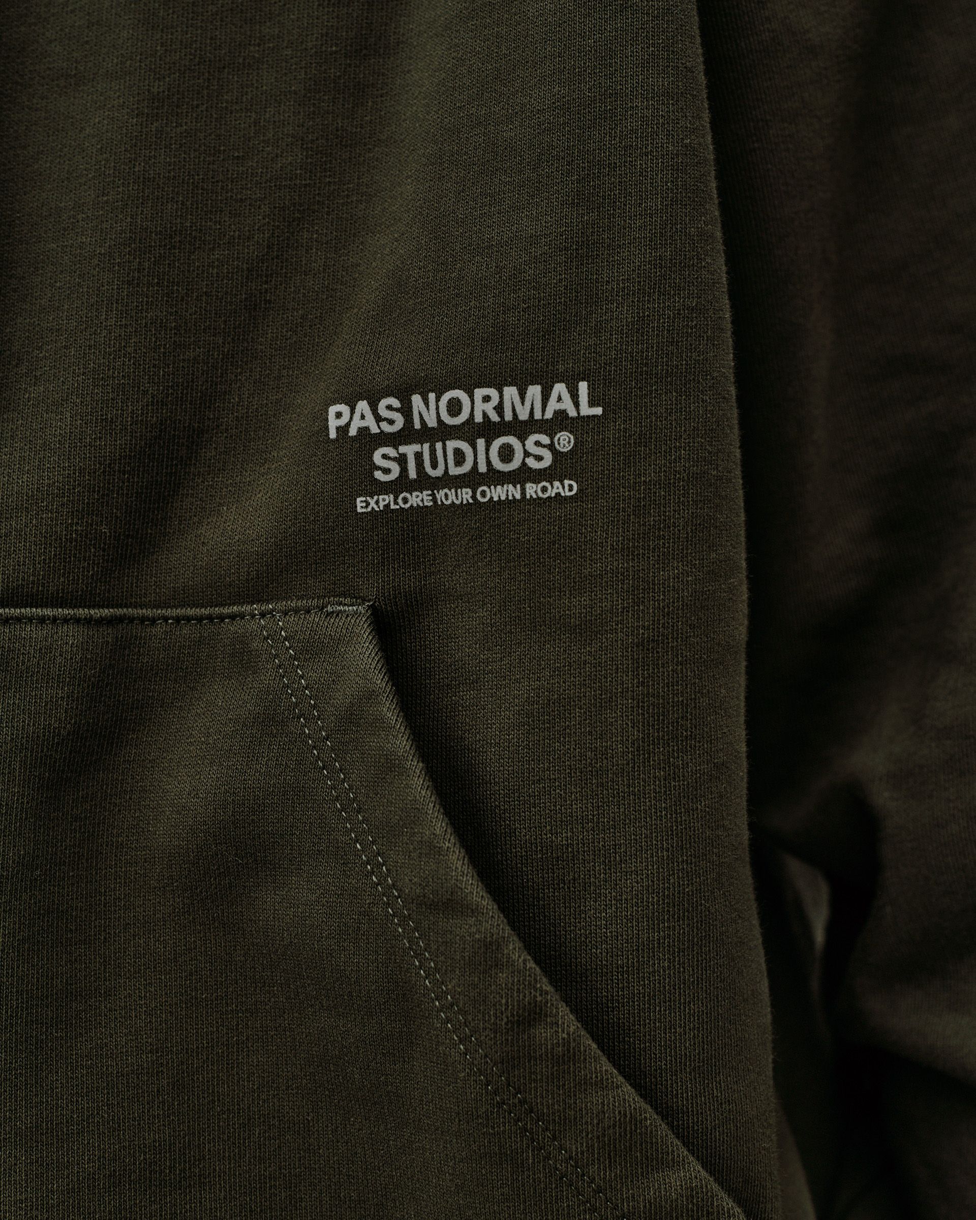 Dark Olive Off-Race hoodie, detail view of chest logo print and kangaroo pocket