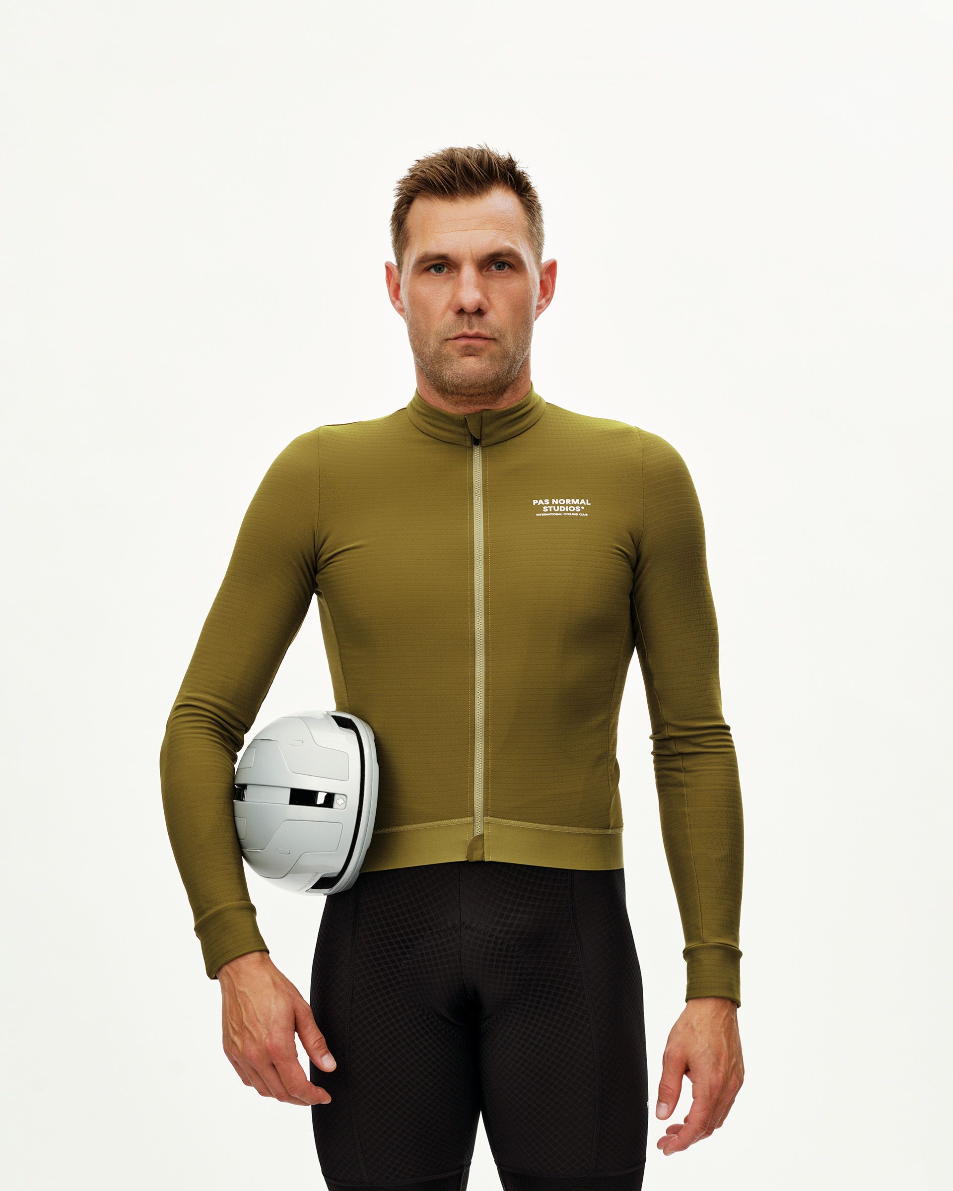 Khaki Green Essential long sleeve cycling jersey on model, front view with chest logo print