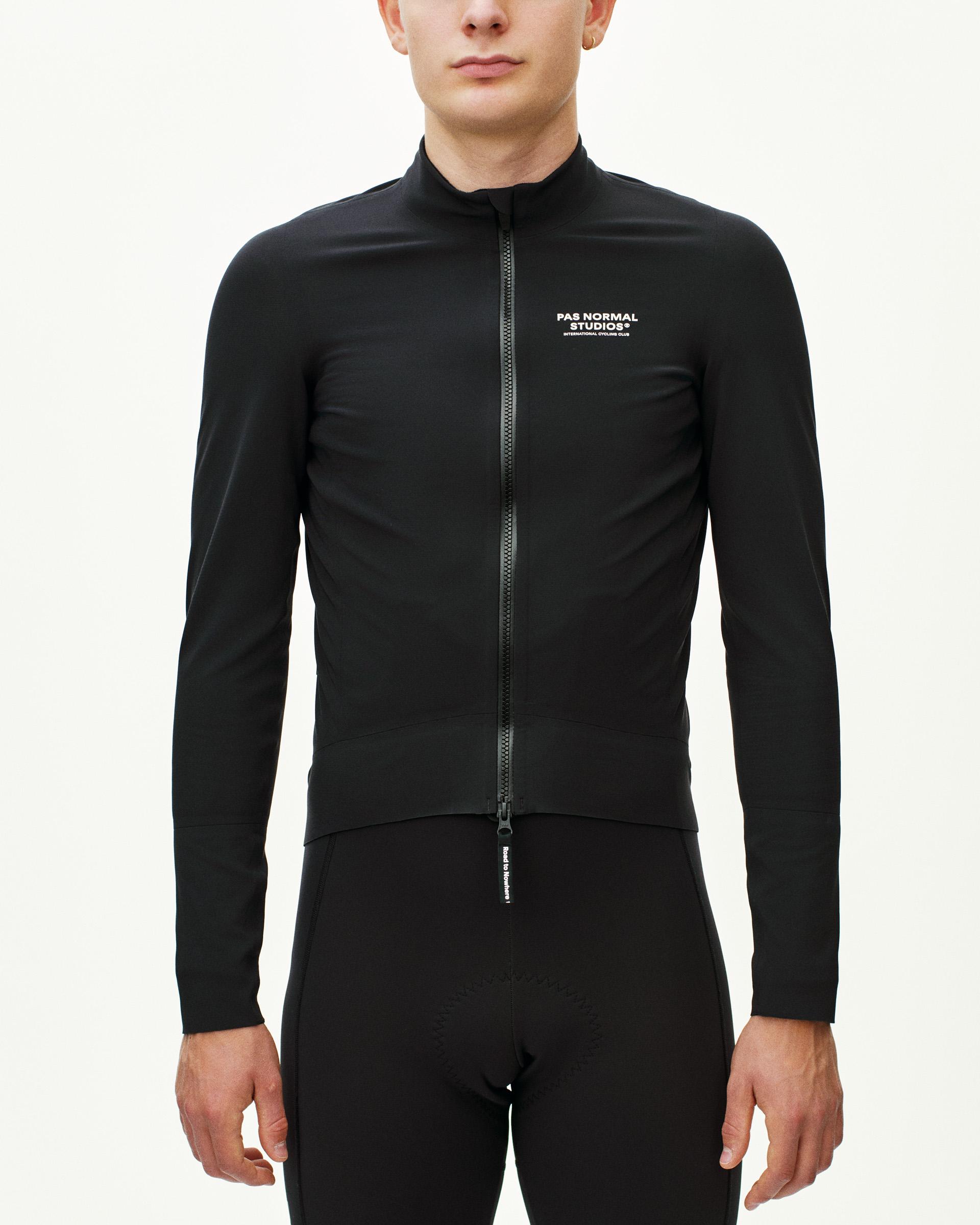 Black Mechanism Thermal cycling jacket on model with full zip and white chest logo