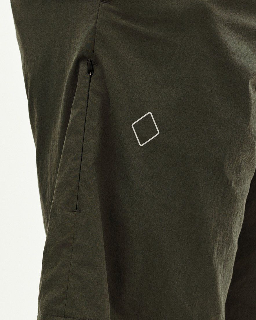 Dark Grey Off-Race Light Tech shorts, side detail view with zippered pocket and white square logo