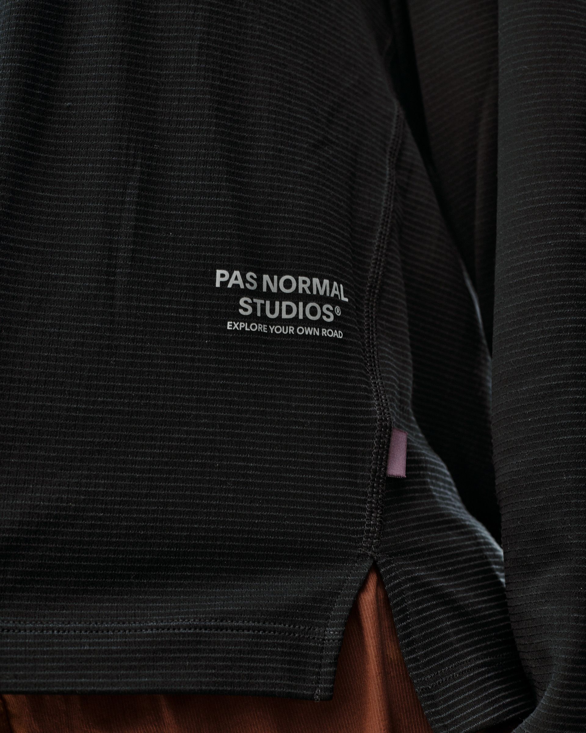 Black Balance long sleeve T-shirt, detail view on model with ribbed texture and chest logo print