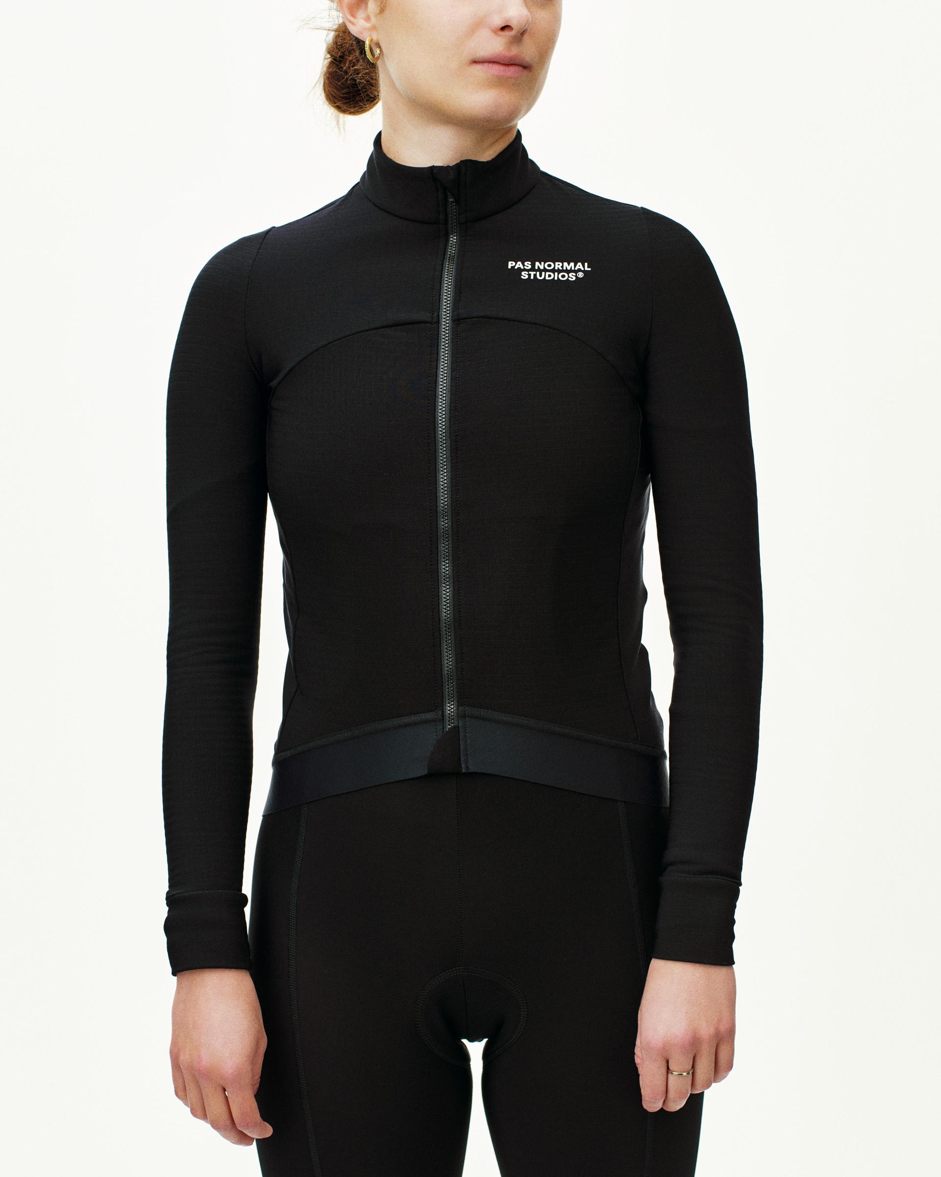 Black Essential long sleeve cycling jersey on model with full zip and chest logo