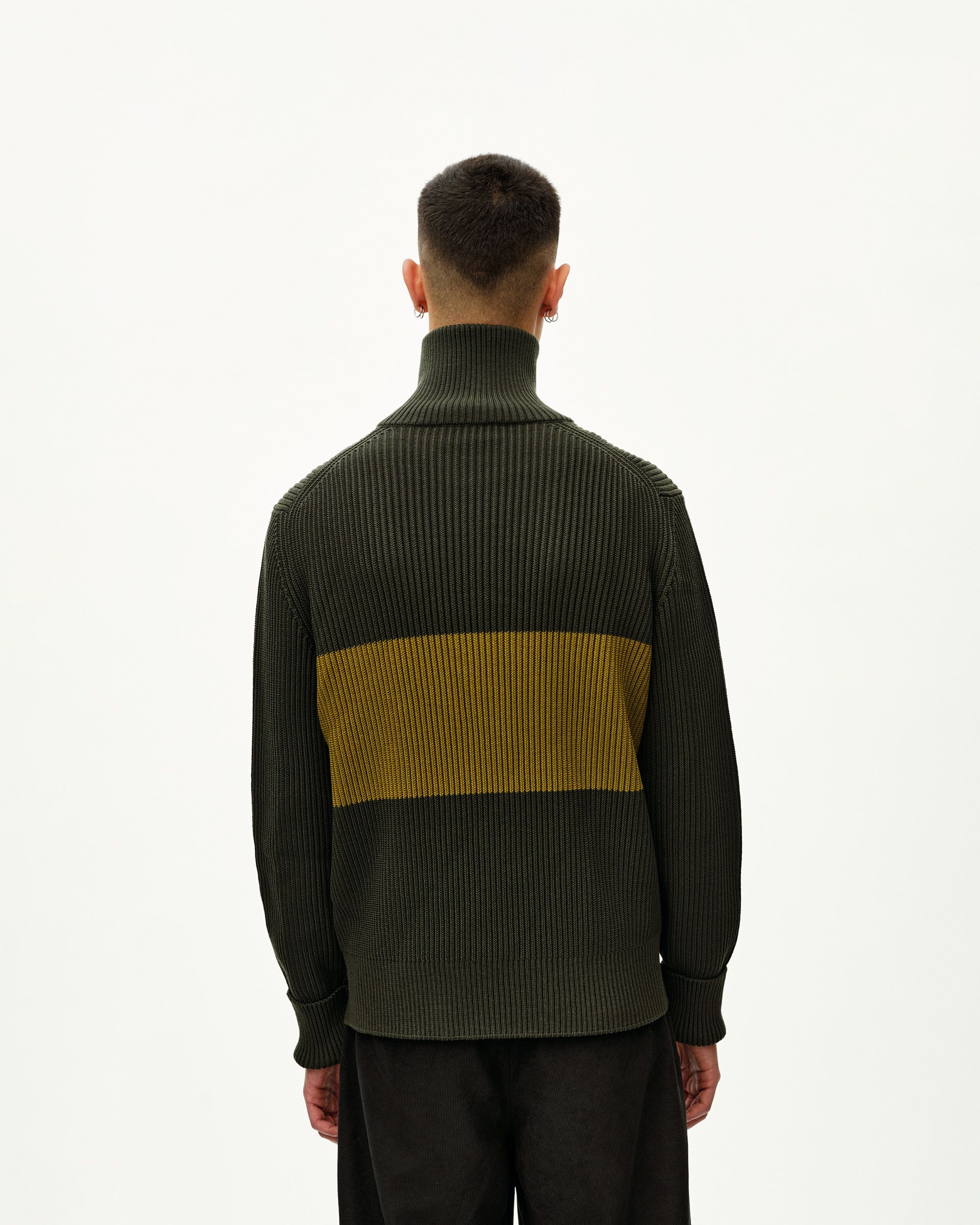 Olive Off-Race Merino Knit Half-Zip sweater, rear view on model with yellow contrast stripe panel