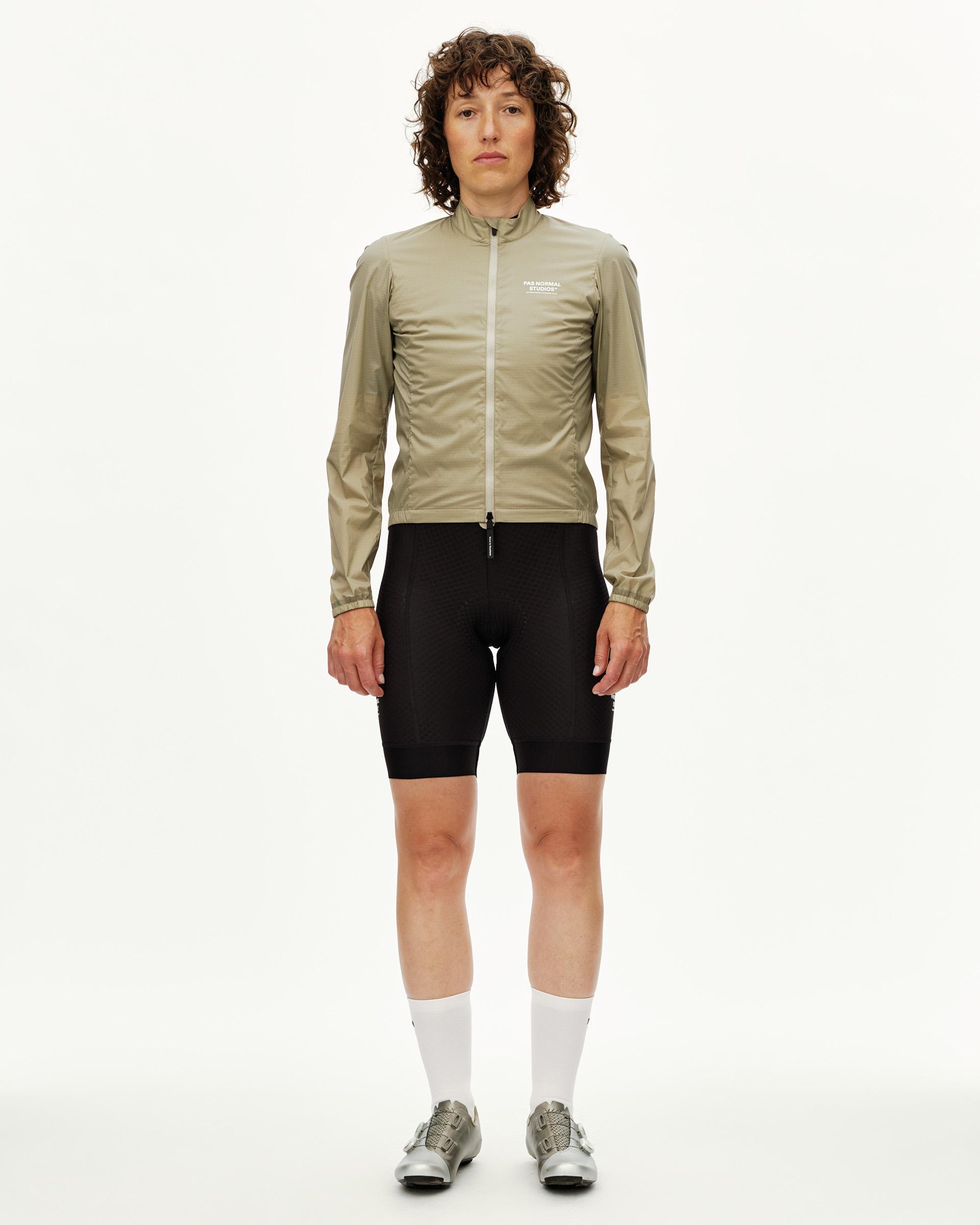 Grey Sage Essential Insulated cycling jacket on model, front view with full zip and white chest logo