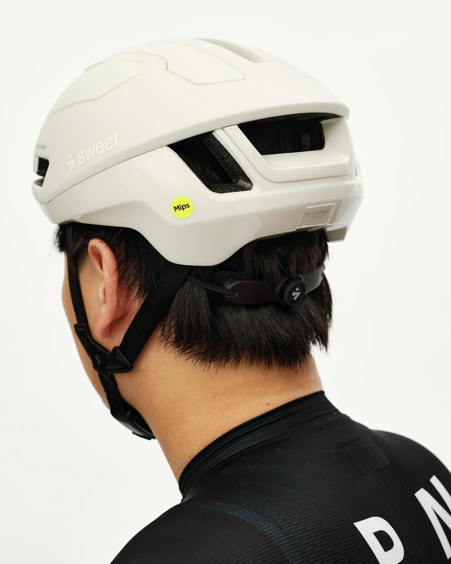 Off White Sweet Protection Falconer Aero 2Vi MIPS Round Fit cycling helmet, rear on-model view with vented shell