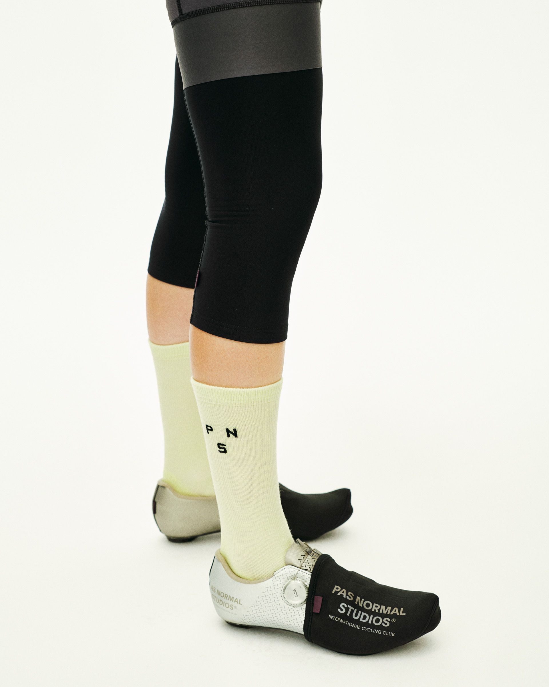 Green Thermal Wool cycling socks on model with black logo detail