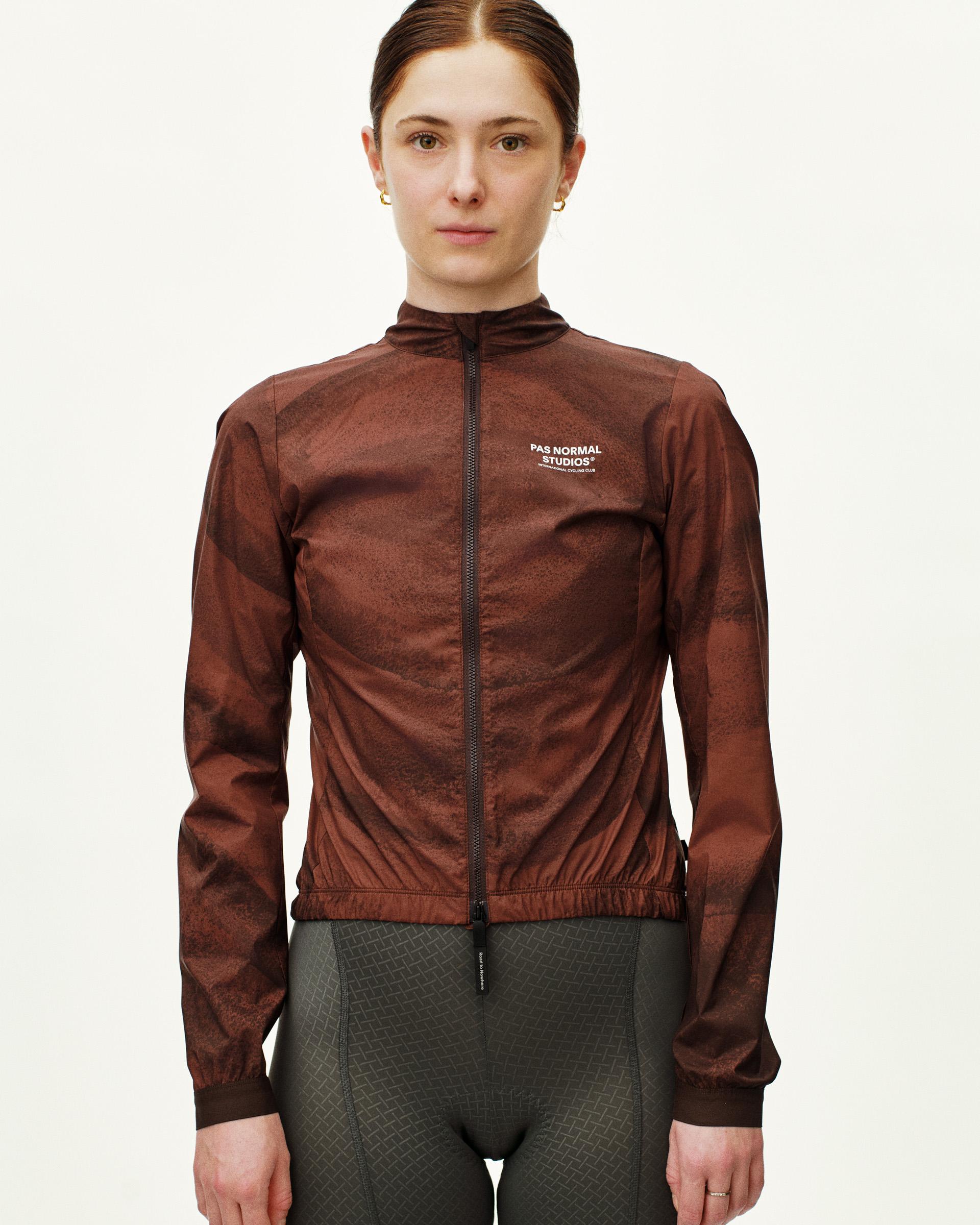 Brown Mechanism Stow Away cycling jacket on model, front view with full zip