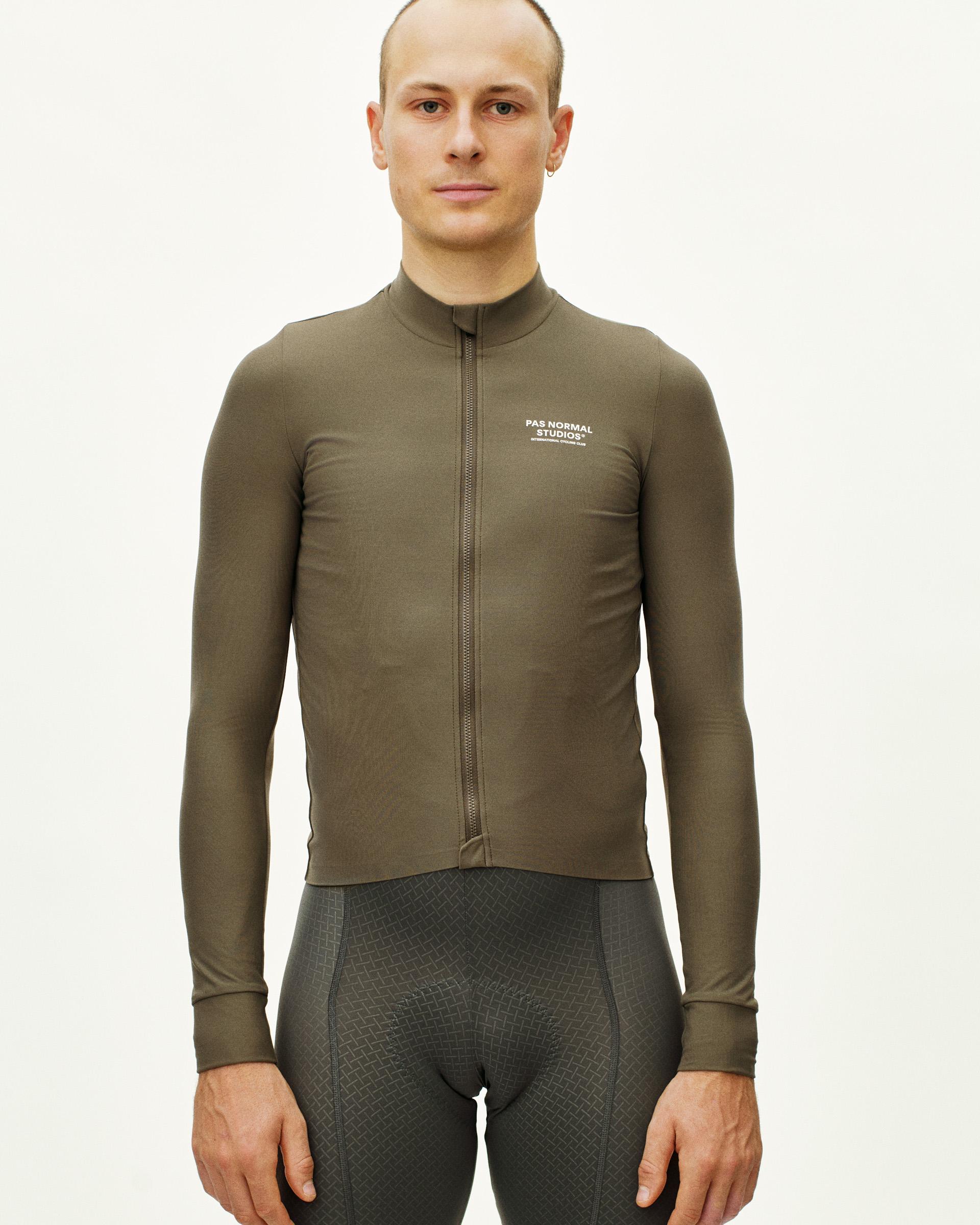 Mud Mechanism long sleeve cycling jersey on model with full front zip and white chest logo