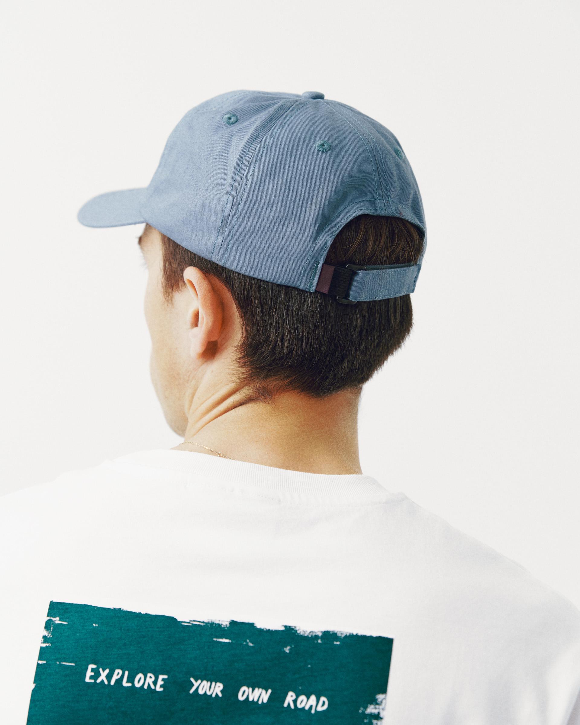 Light Blue Off-Race Cotton cap, rear view on model with adjustable strap