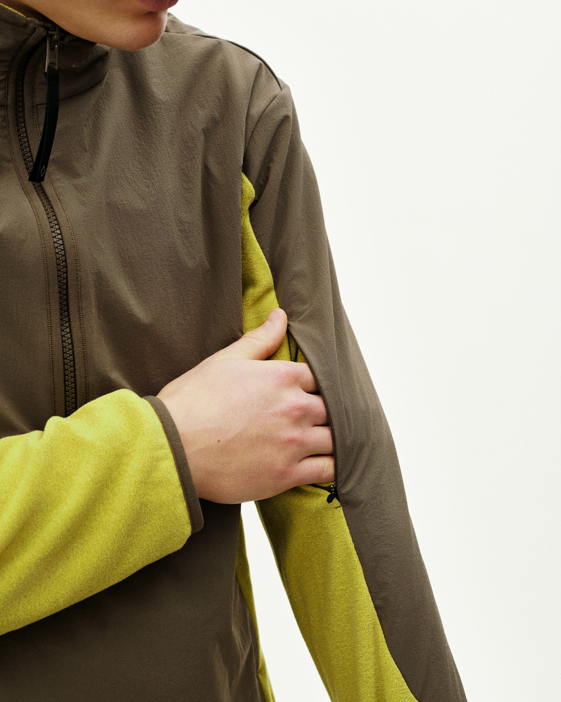 Brown Off-Race Light Fleece Half-Zip outerwear on model with yellow contrast sleeves and side panels