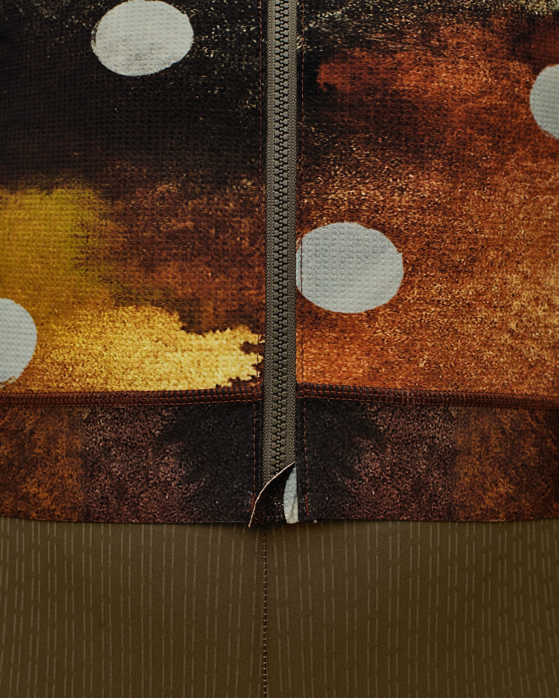 Brown T.K.O. Essential Light long sleeve cycling jersey, detail view with orange and yellow camouflage print