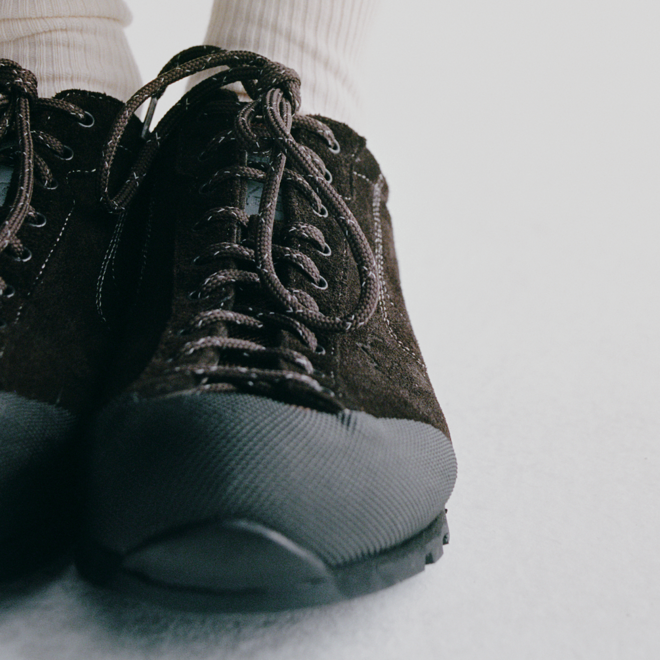 Black Diemme collaboration sneakers with textured upper and lace-up design