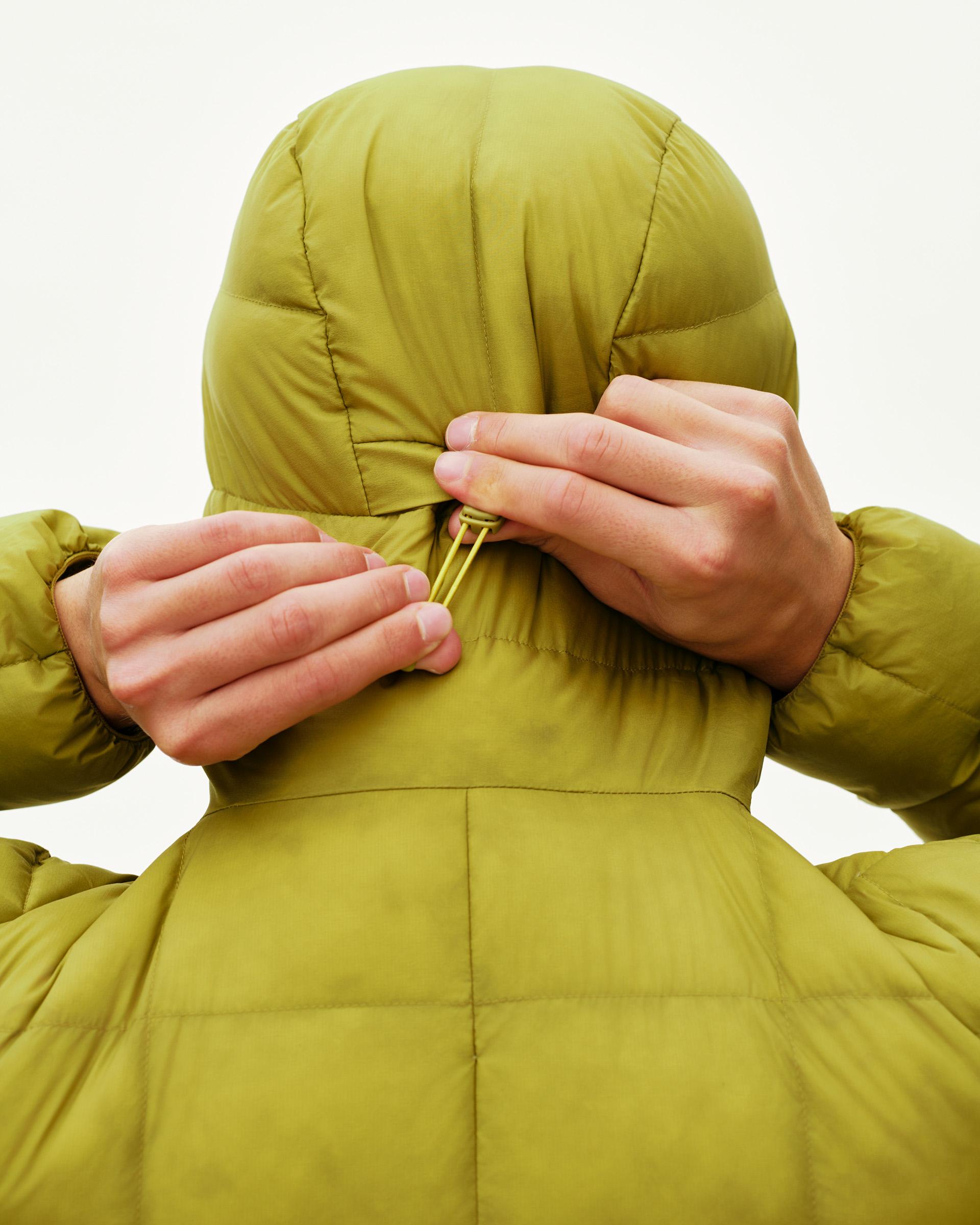 Dark Lime green Off-Race Down Liner jacket on model, rear detail view with hood drawcord adjustment