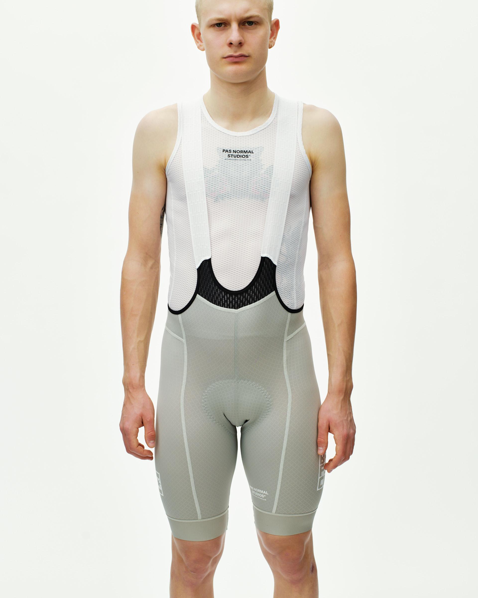 Light Grey Breakfast Club Mechanism cycling bibs on model with white mesh bib and black contrast panel