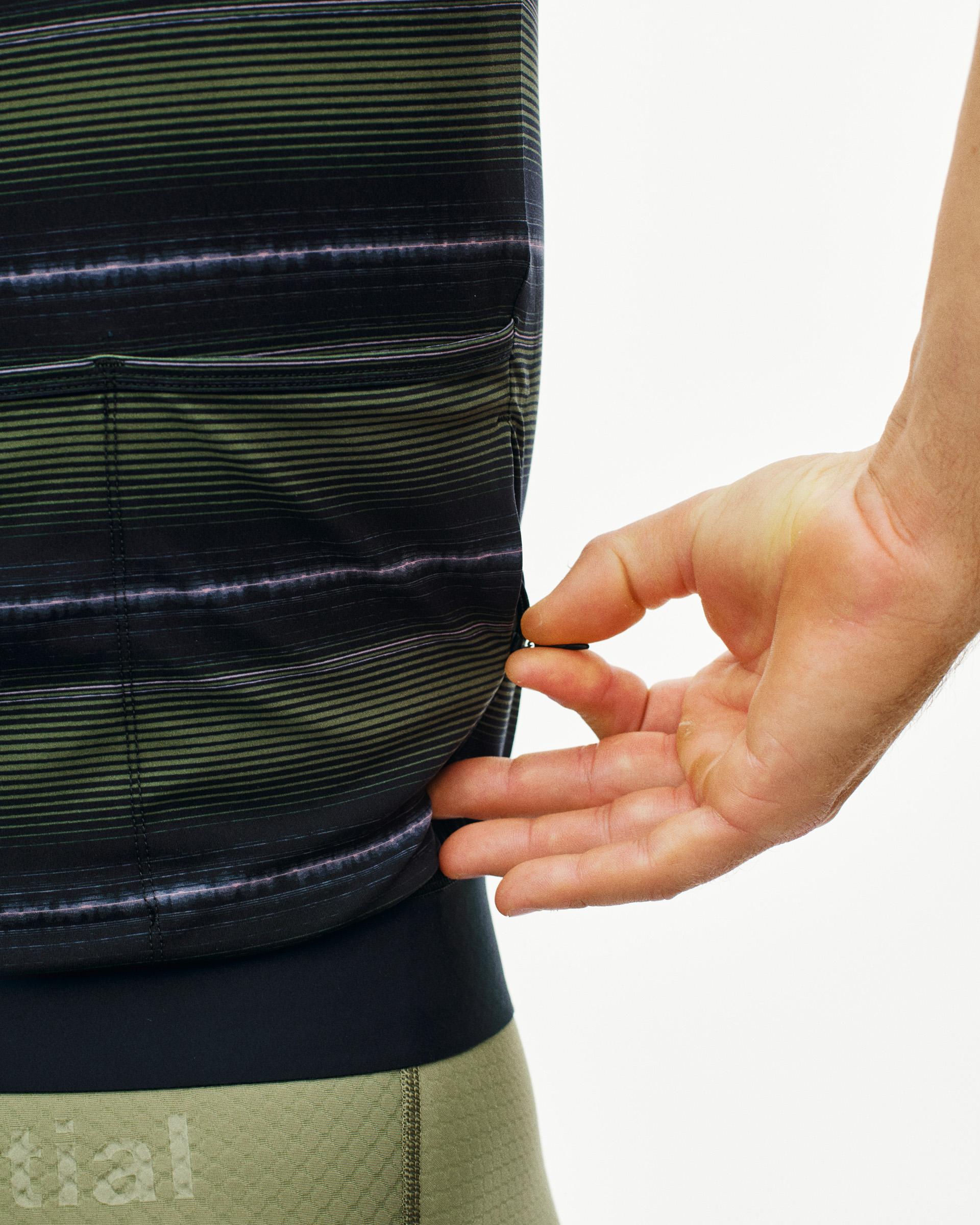 Light Olive Essential cycling jersey on model showing striped pattern with rear pocket