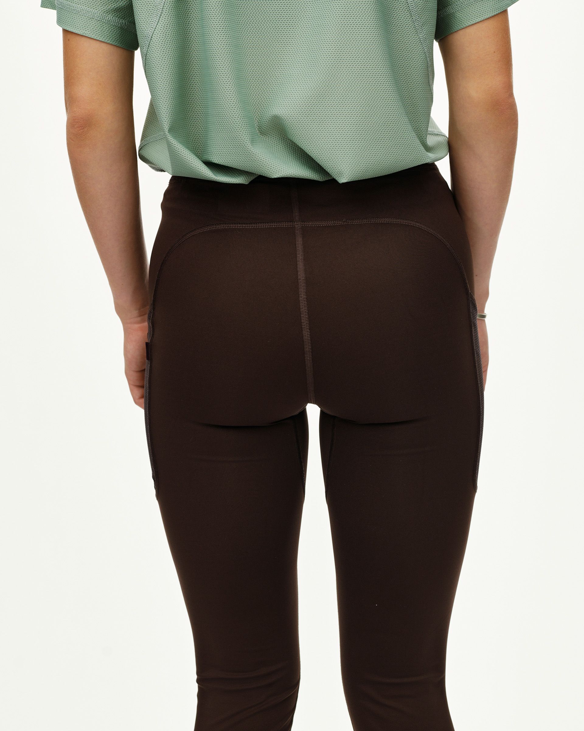 Dark Coffee Balance women's long cycling tights on model, rear view with contrast side panels
