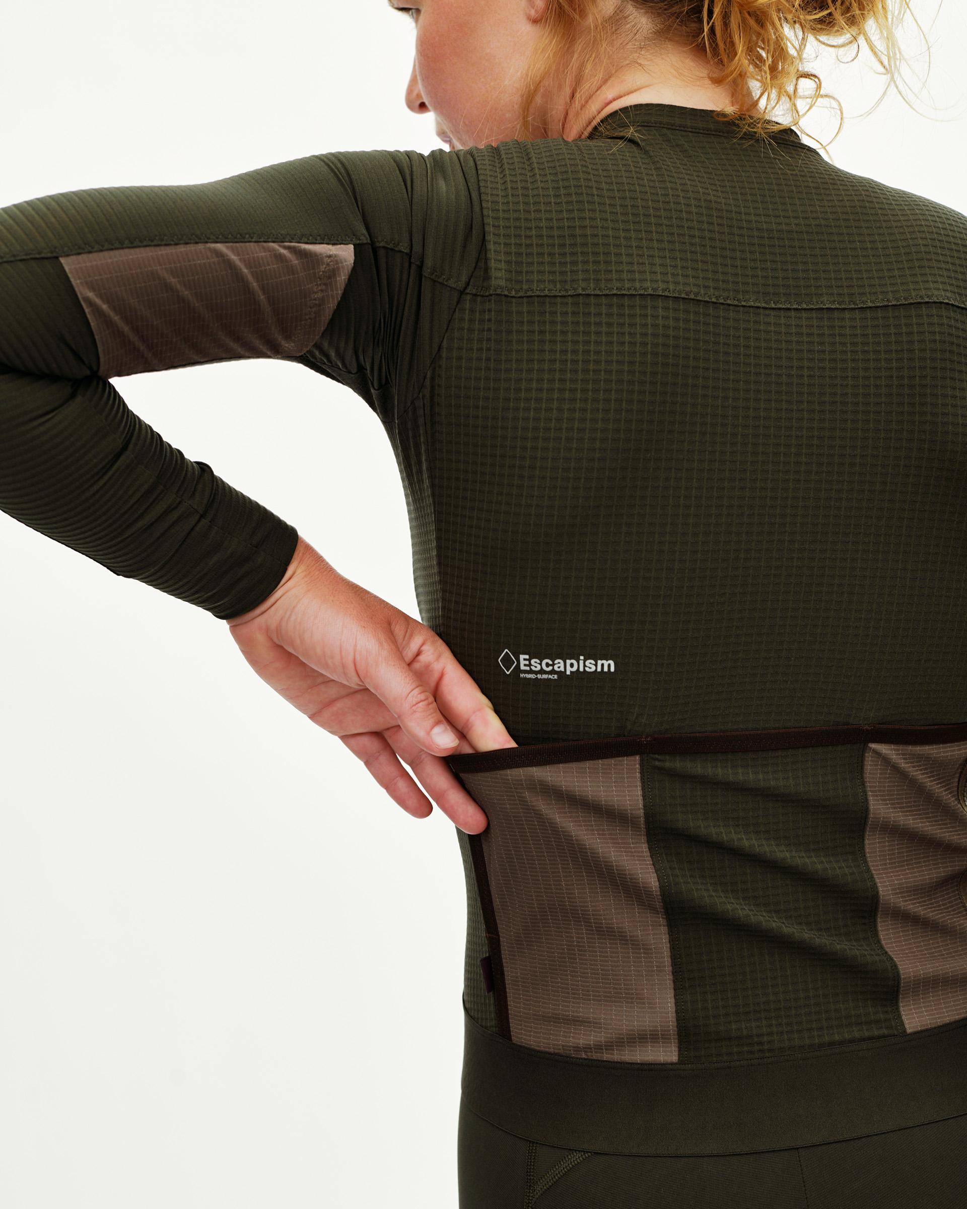 Dark Olive Escapism women's long sleeve cycling jersey, rear view on model with grid texture and contrast brown panels