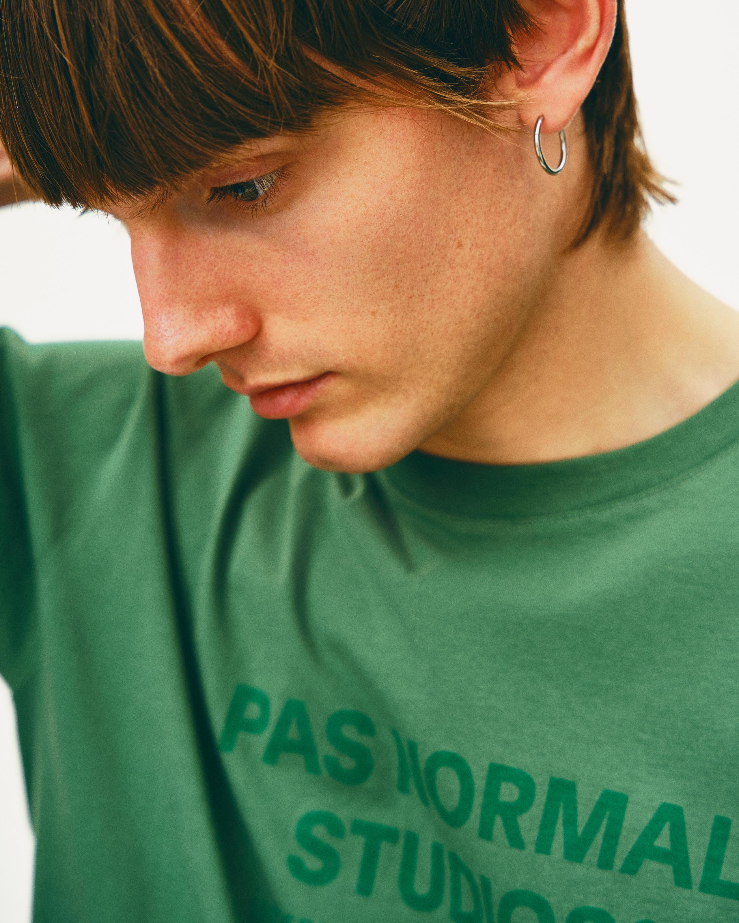 Green Off-Race Logo t-shirt on model with dark green chest print