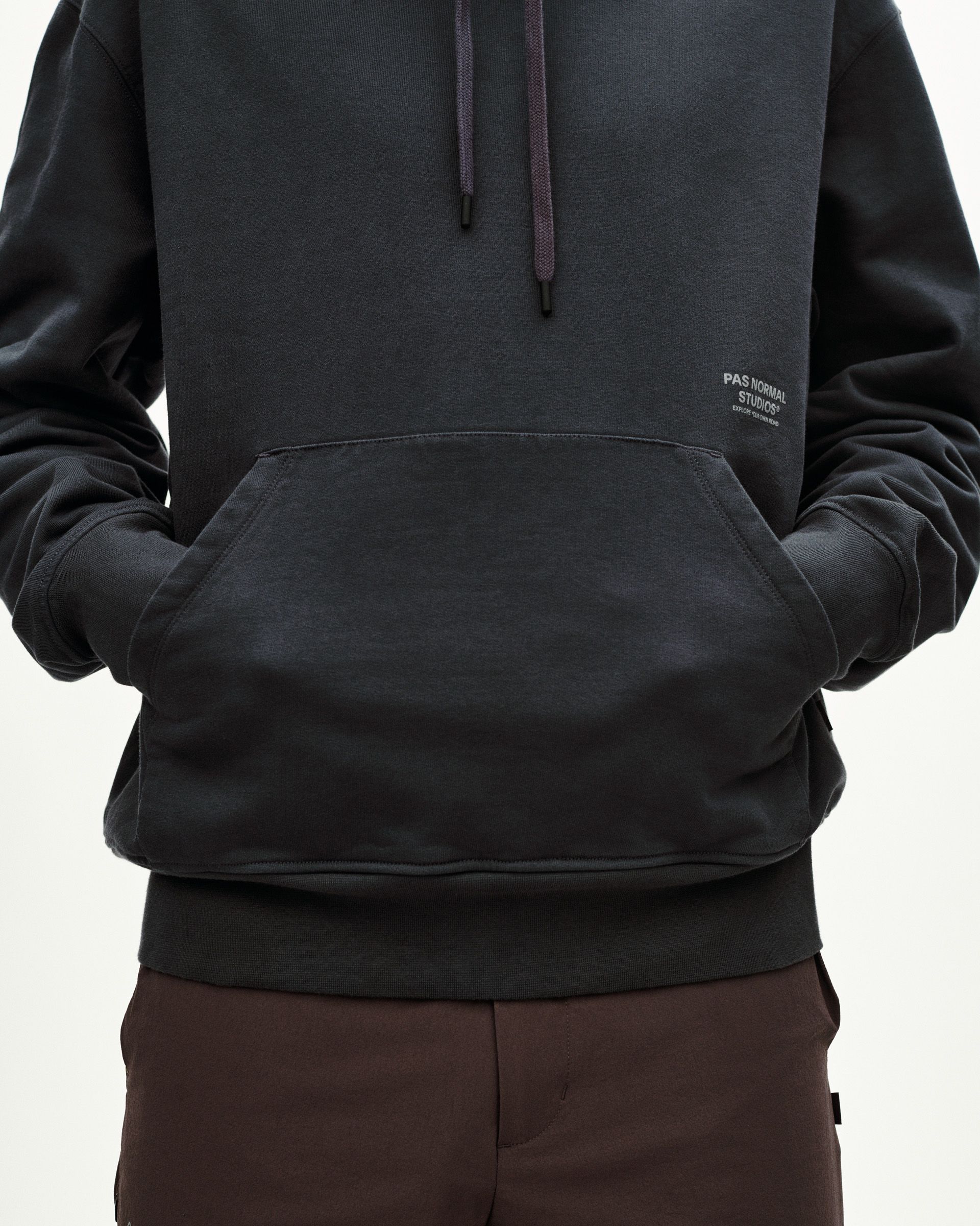 Dark Navy Off-Race Graphic hoodie, front view on model with kangaroo pocket and drawstring hood