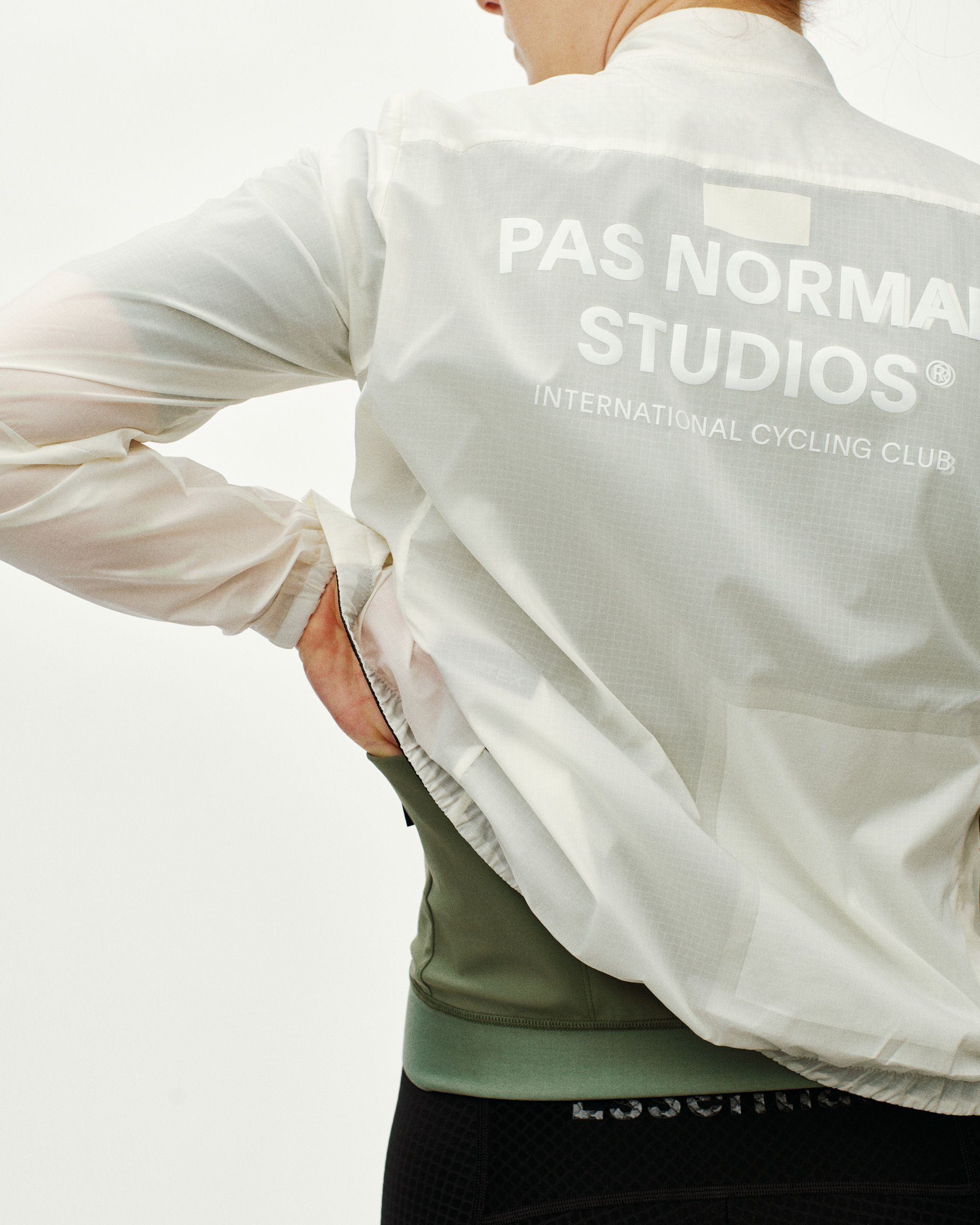 Off White Essential cycling jacket on model, rear view with large back logo print