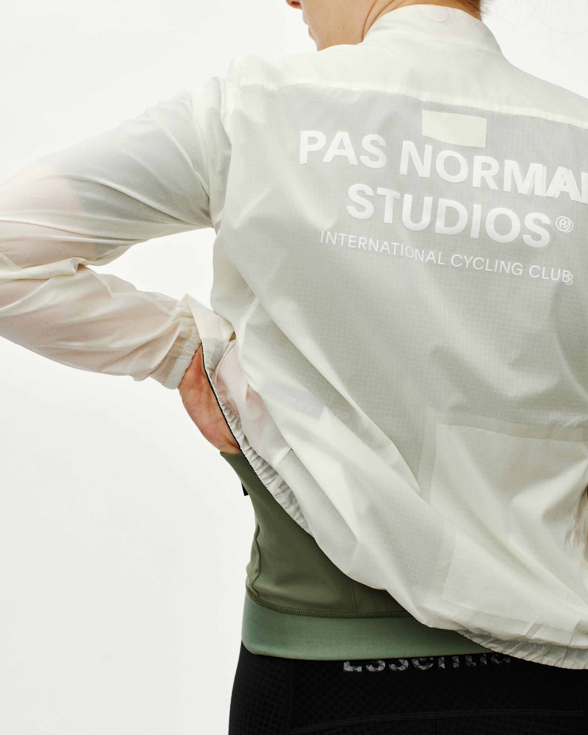 Off White Essential cycling jacket on model, rear view with large back logo print