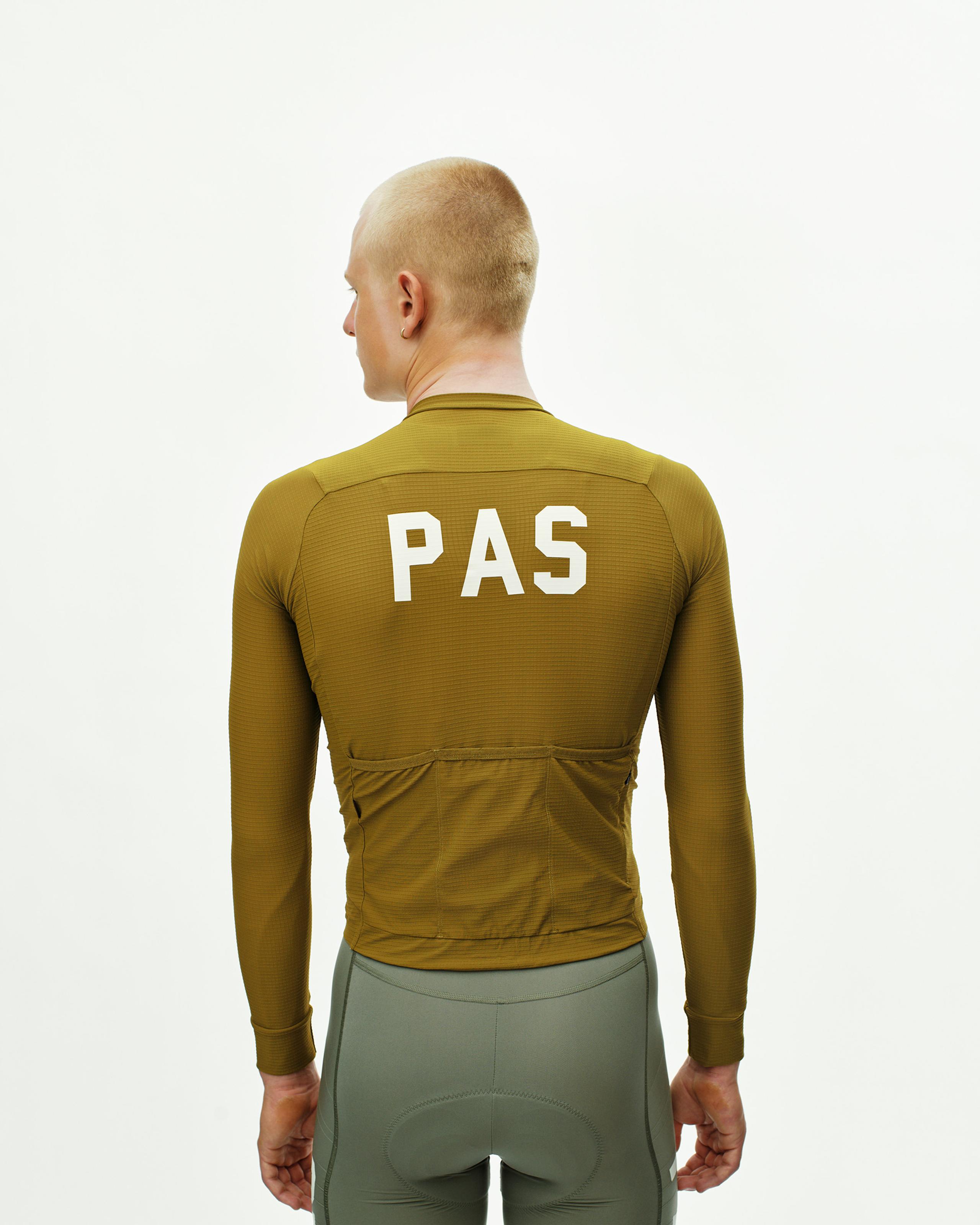 Khaki Green PAS Mechanism Pro long sleeve cycling jersey, rear view on model with white PAS back print