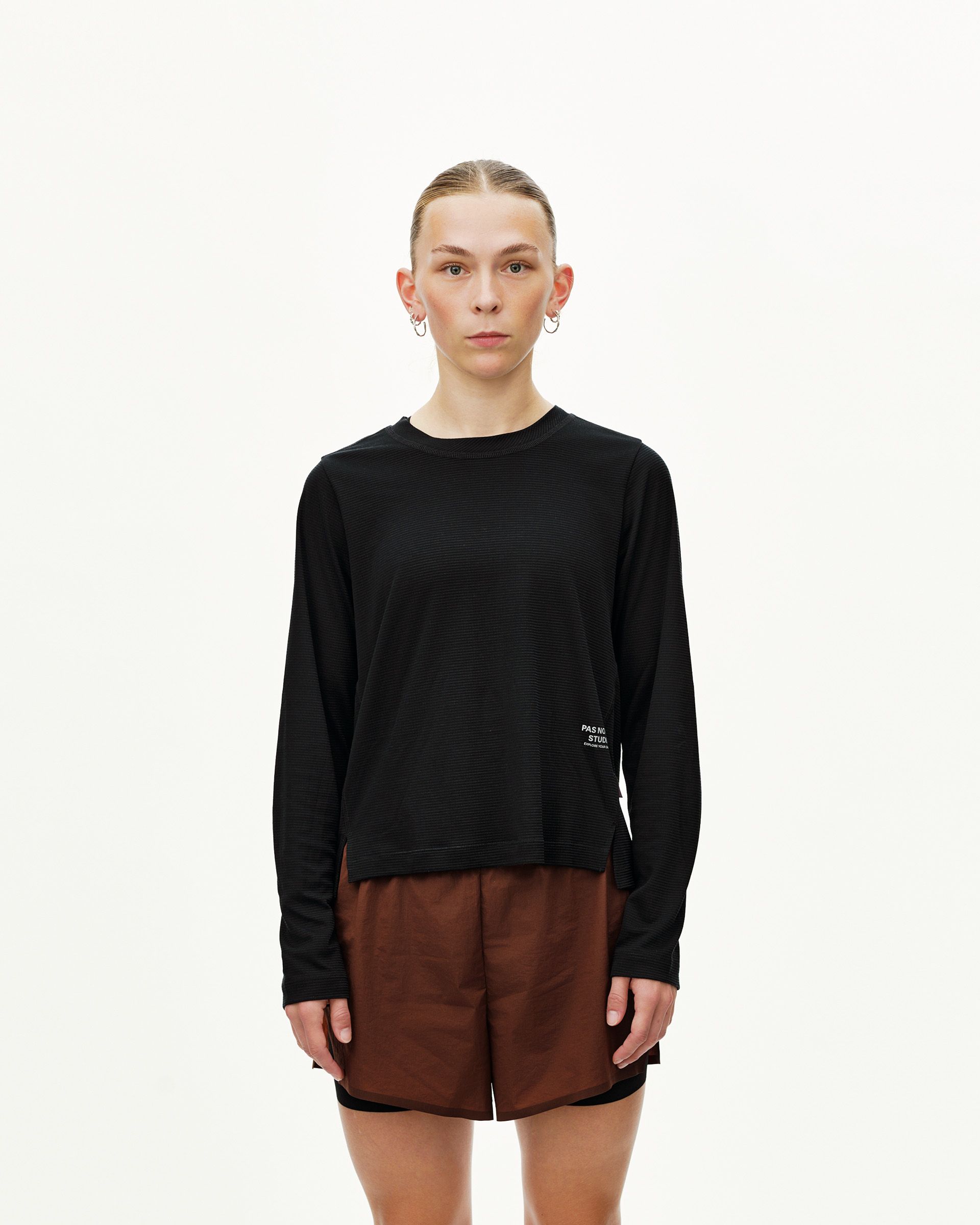 Black Balance long sleeve T-shirt, front view on model with small chest logo print