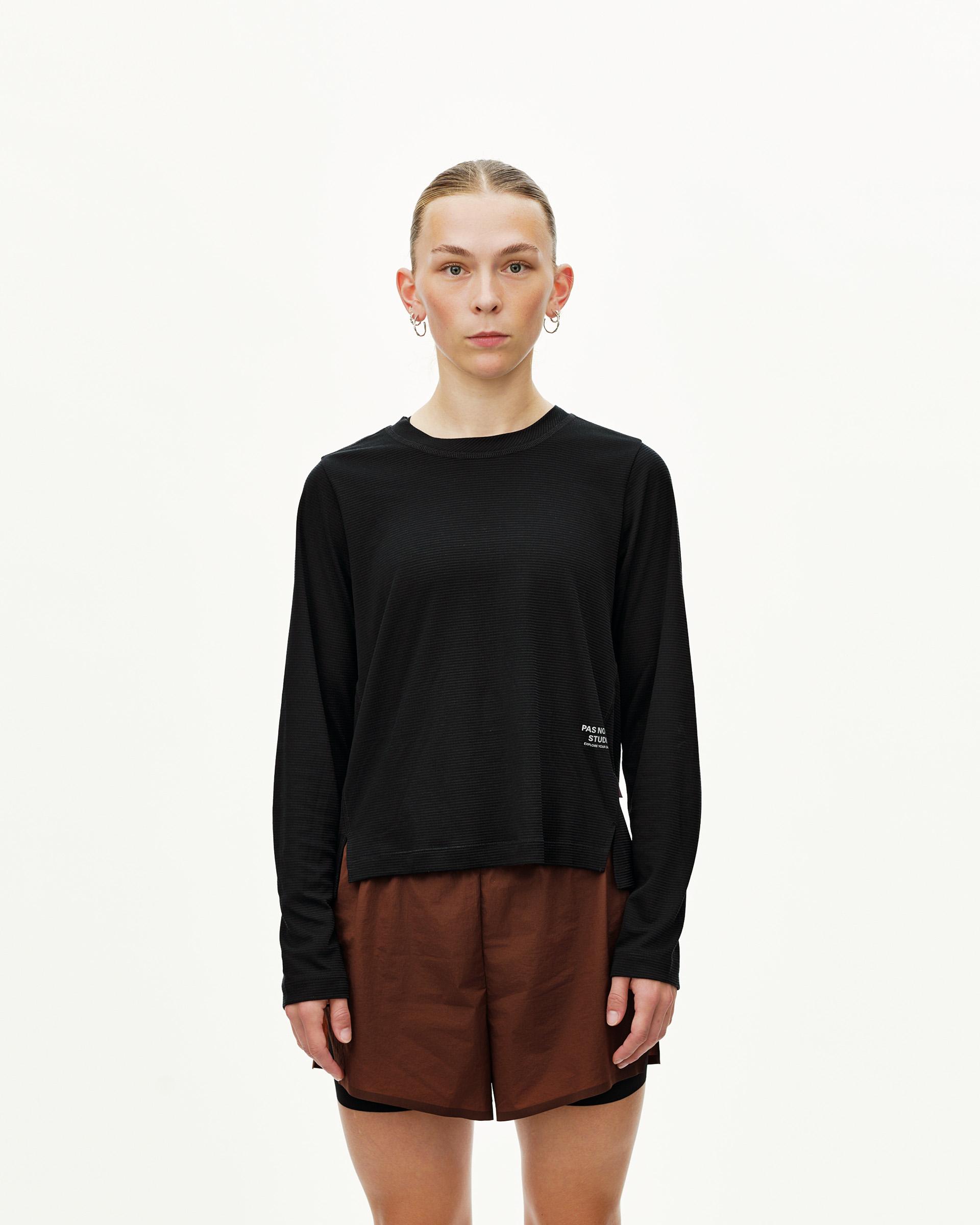Black Balance long sleeve T-shirt, front view on model with small chest logo print